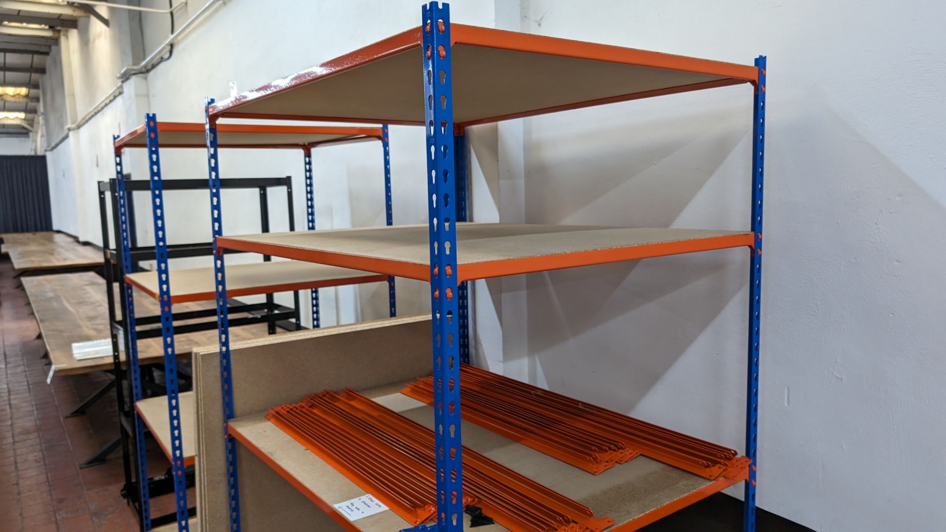 4 off bays of Rapid Racking blue and orange racking, each with four shelves. One bay has a footprin - Bild 8 aus 8