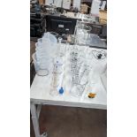 Approximately 20 off assorted glass measuring receptacles and similar plus quantity of plastic measu