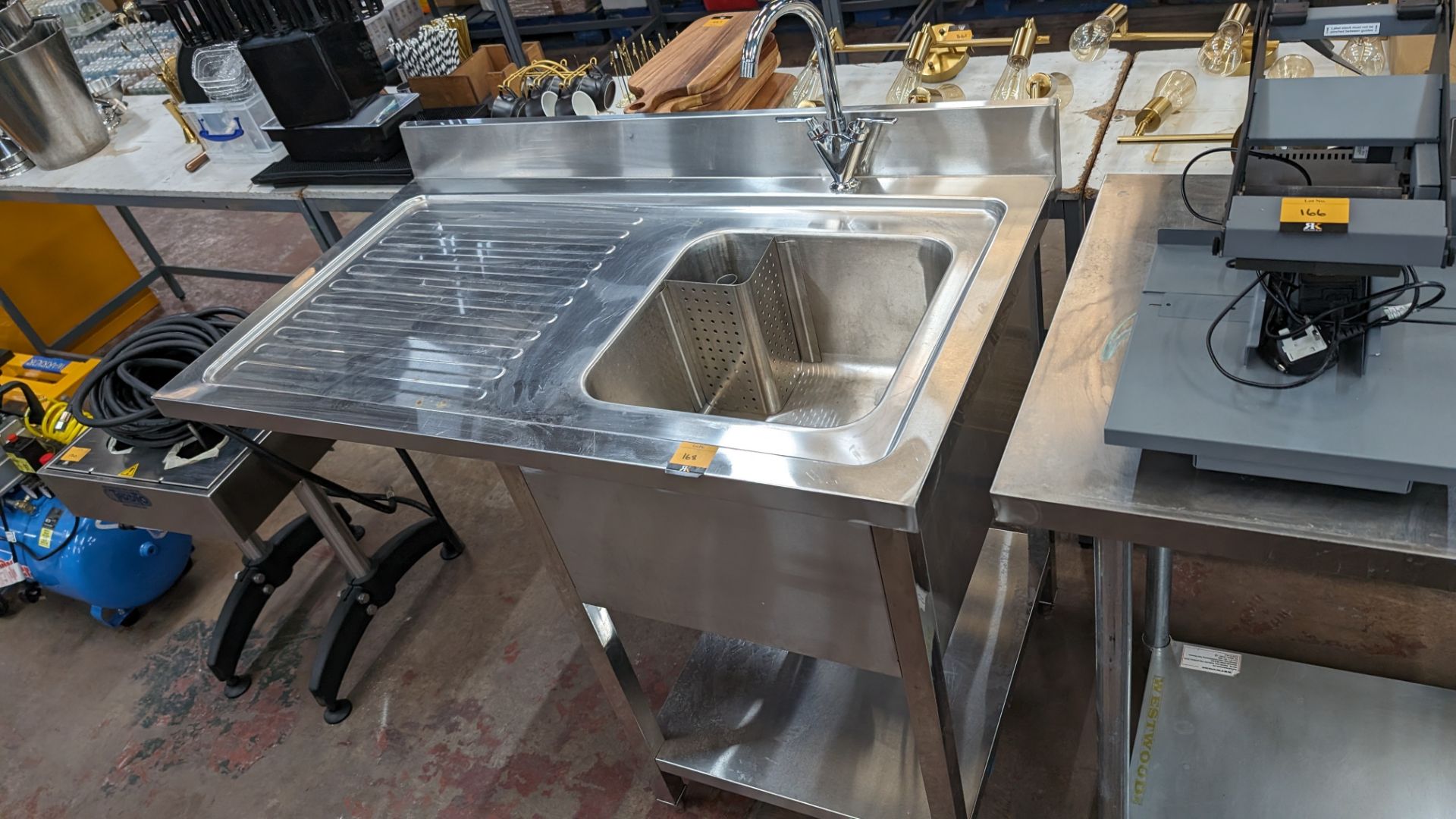 Stainless steel floor standing basin with drainer to the side plus mixer tap