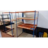 4 off bays of Rapid Racking blue and orange racking, each with four shelves. One bay has a footprin