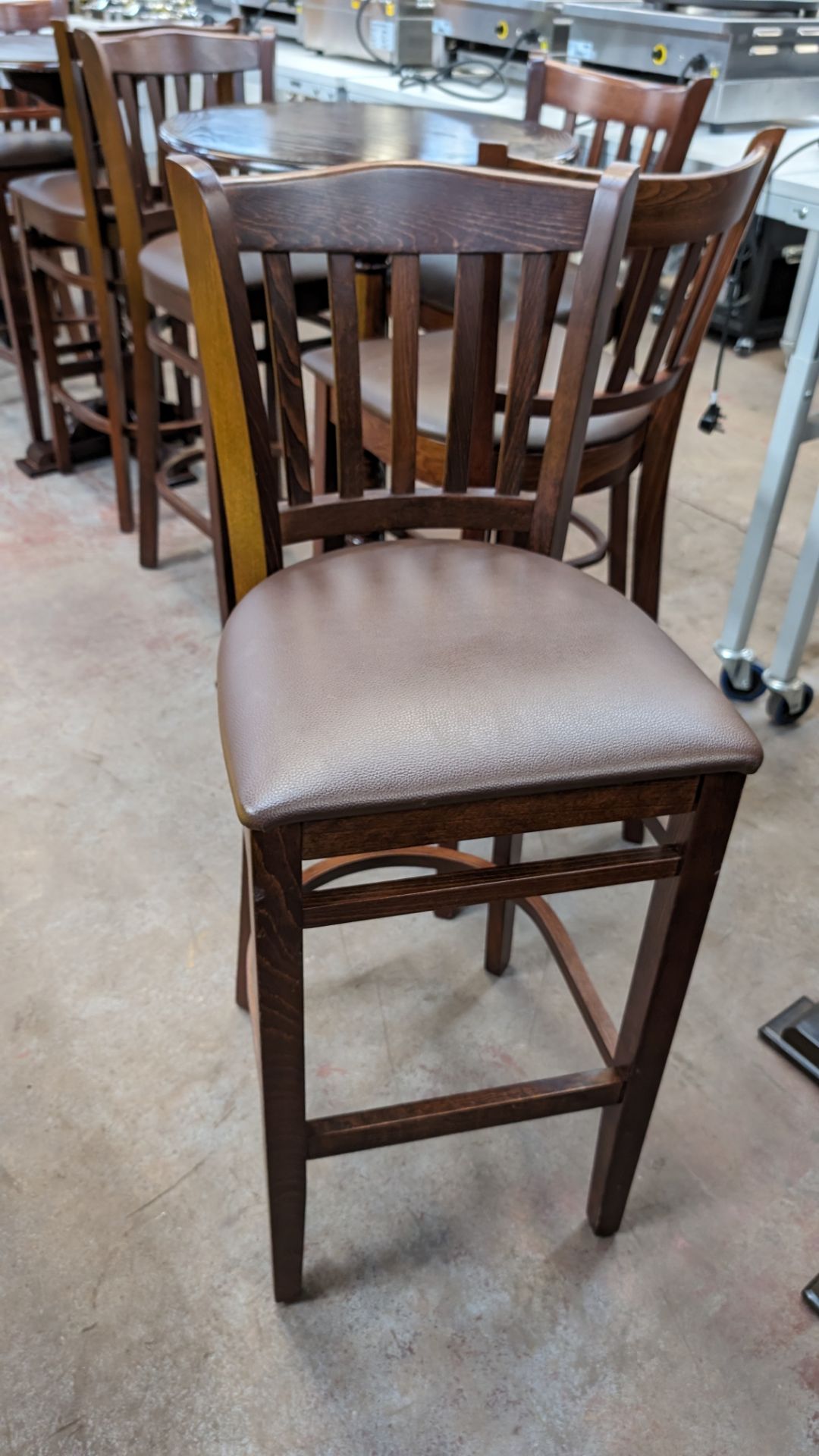 8 off matching high back wooden bar seats/stools with upholstered seat bases. NB: These high chairs