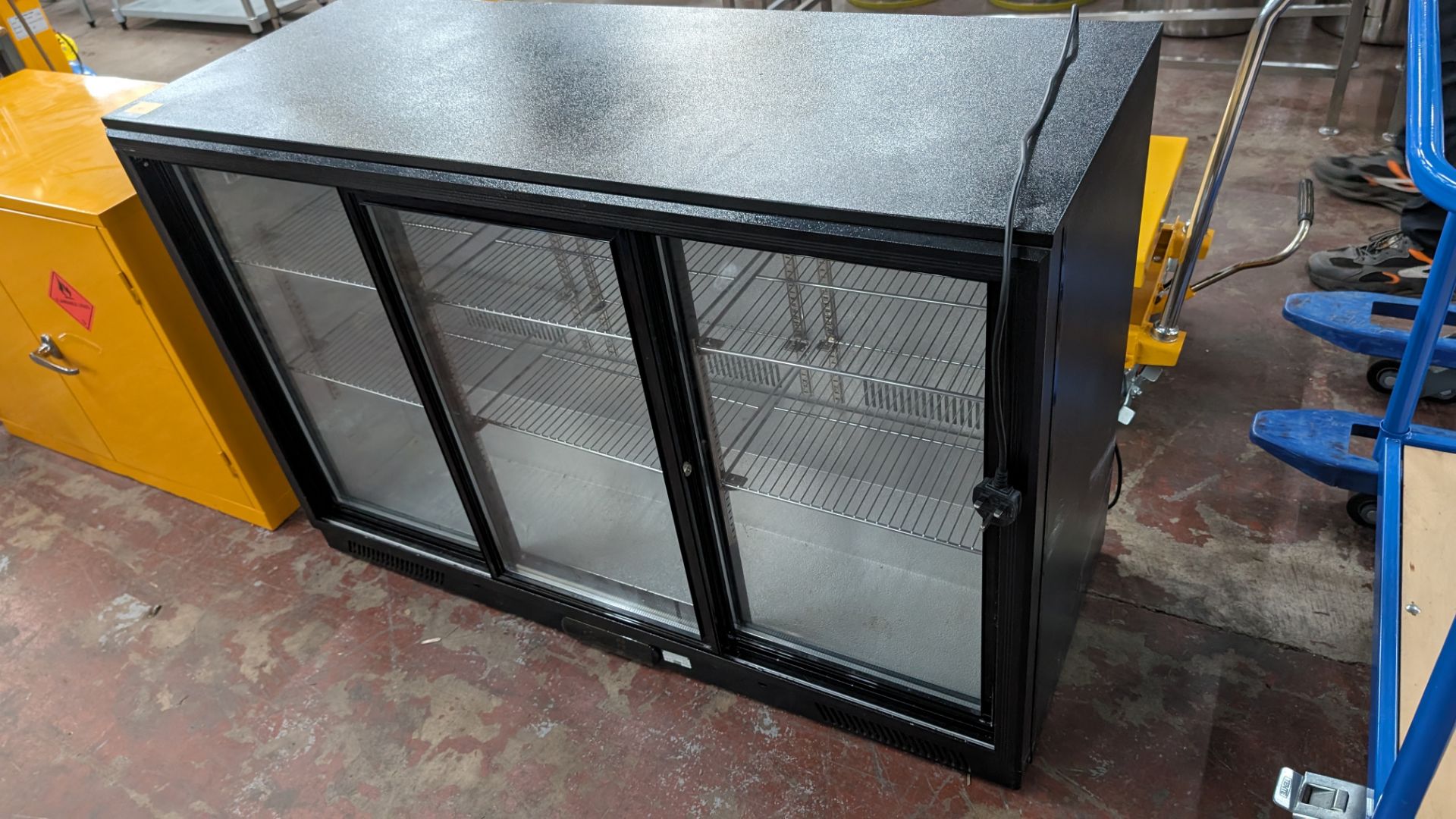 Large black undercounter/back bar bottle fridge with triple clear sliding doors