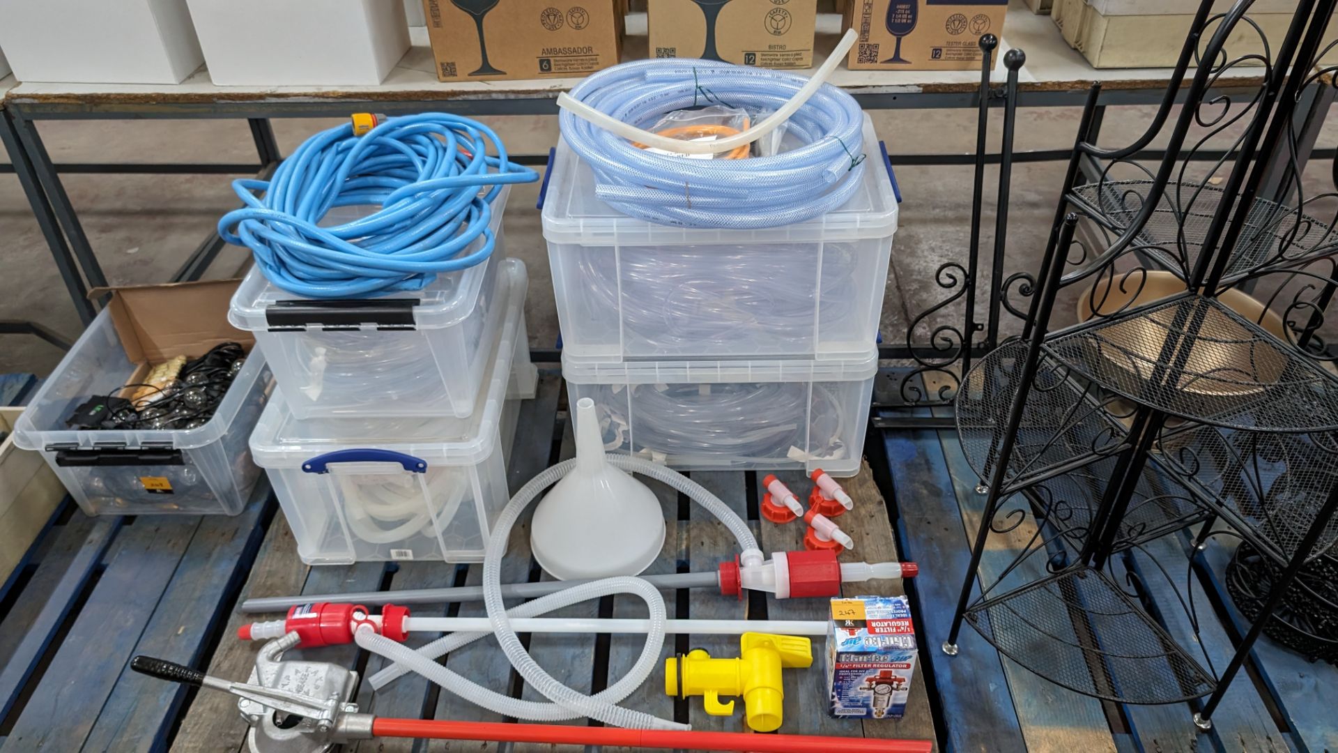 The contents of a pallet of hose, pumps and related items. NB: Plastic crates excluded