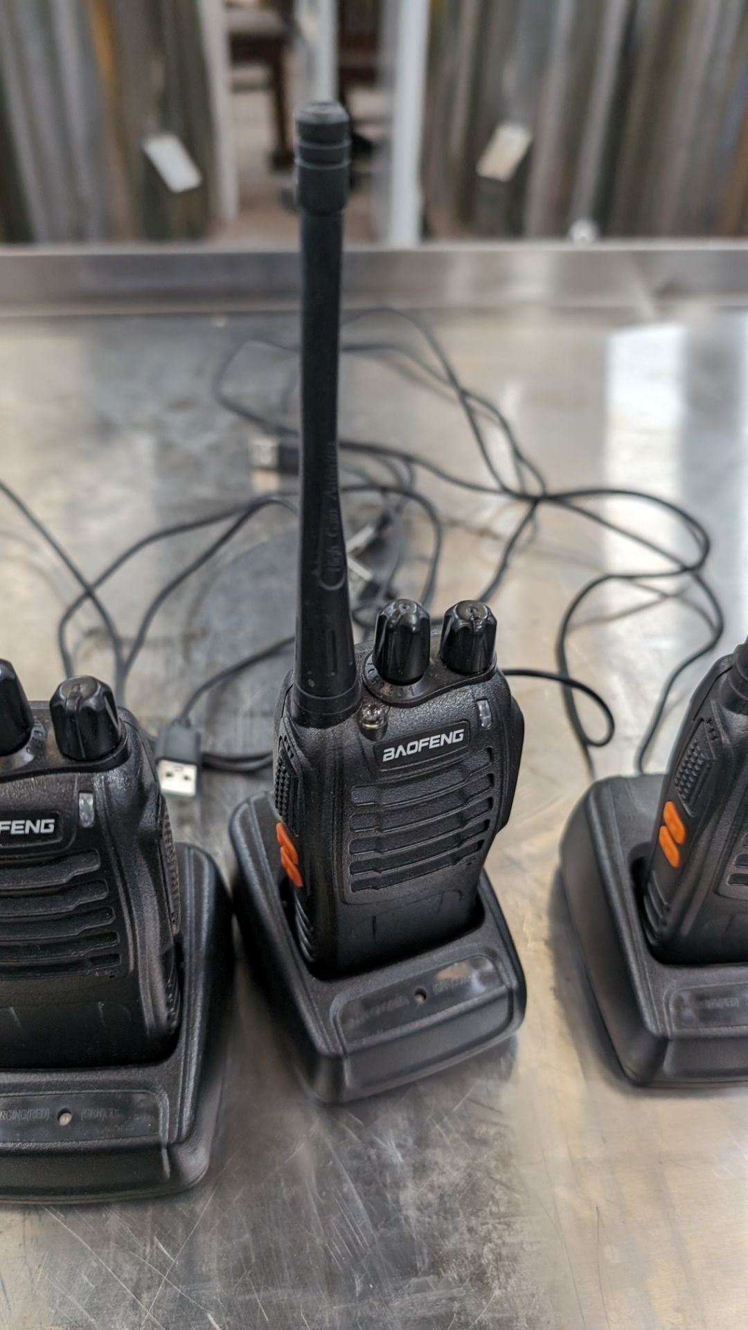 4 off Baofeng walkie-talkies each with their own charging base - Image 6 of 7