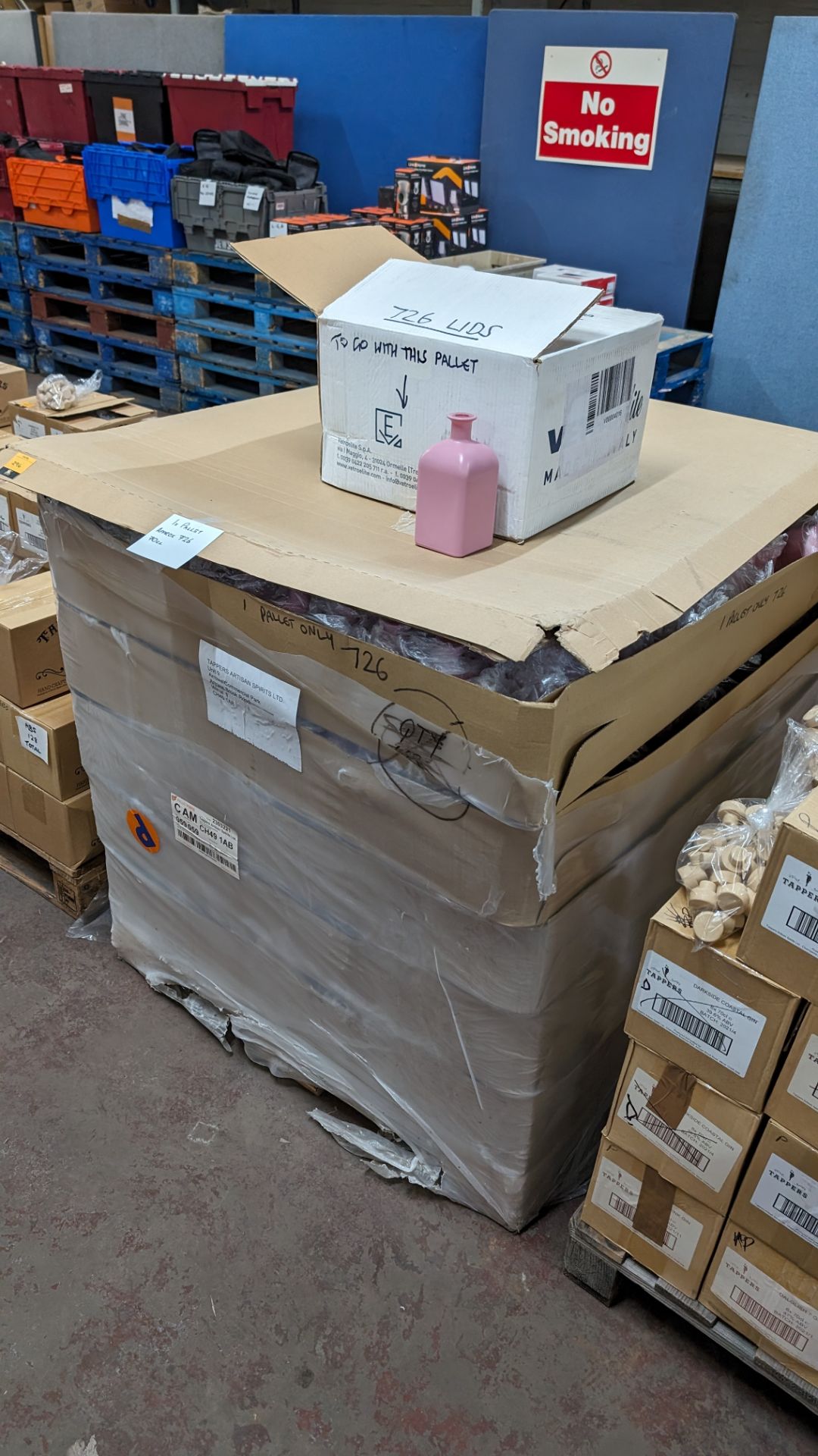 The contents of a pallet of professionally painted pink glass bottles, each bottles being 70c/700ml