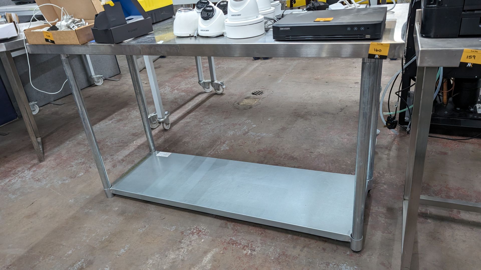 Stainless steel twin tier table, max dimensions: 890mm x 610mm x 1530mm