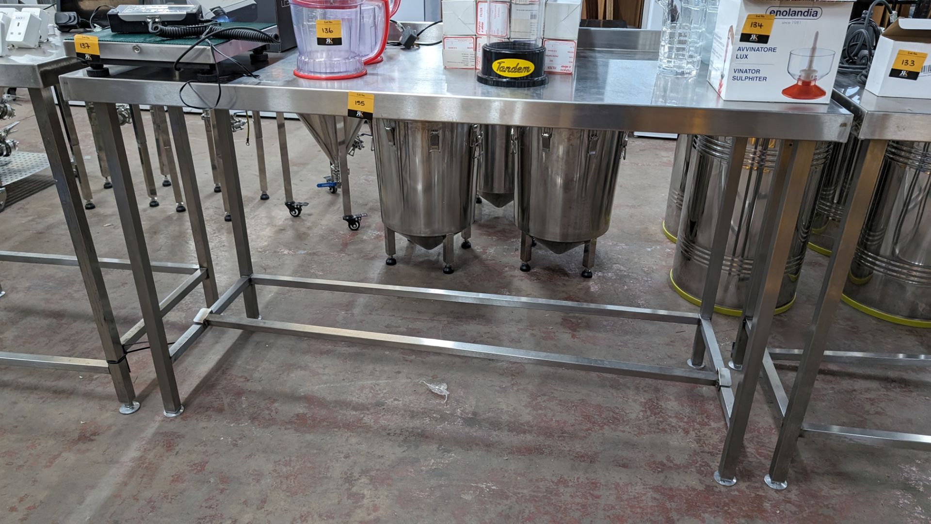 Stainless steel table with upstand at rear, max dimensions: 920mm x 600mm x 1500mm