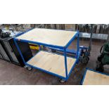 Large heavy duty trolley with braked wheels, comprising blue metal frame and twin plywood shelves