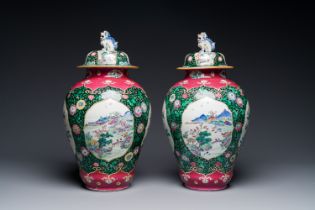 A pair of Chinese famille rose black-ground jars and covers with mountainous landscape design, Yongz