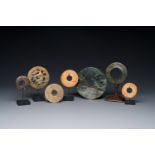 A varied collection of 'bi' discs and jade pendants, China, 1st C. B.C. and earlier