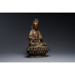 A fine Chinese partly lacquered and gilt bronze sculpture of Bodhisattva on lotus throne, Ming