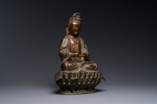 A fine Chinese partly lacquered and gilt bronze sculpture of Bodhisattva on lotus throne, Ming