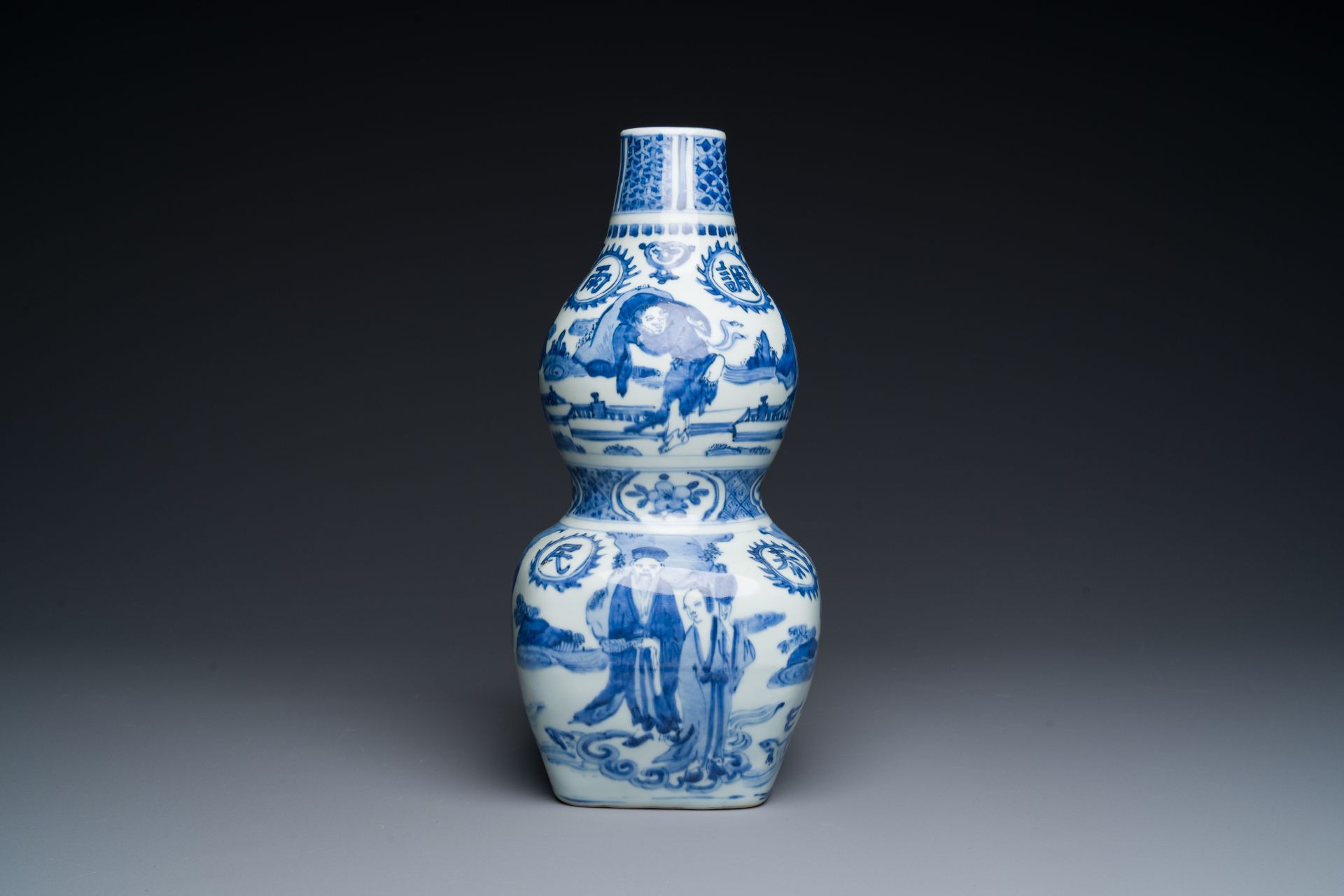 A rare Chinese blue and white double gourd vase with Guo Tai Min An åœ‹æ³°æ°‘å®‰ design, Jiajing/Wan