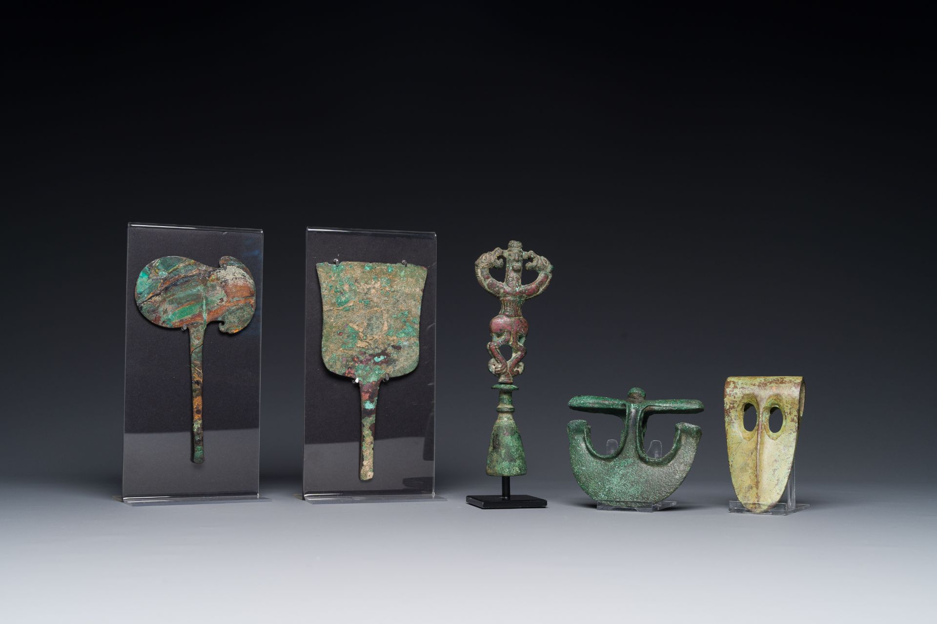 A collection of three bronze axes, a mirror and an anthropomorphic idol with two dragon heads, Luris - Image 2 of 15
