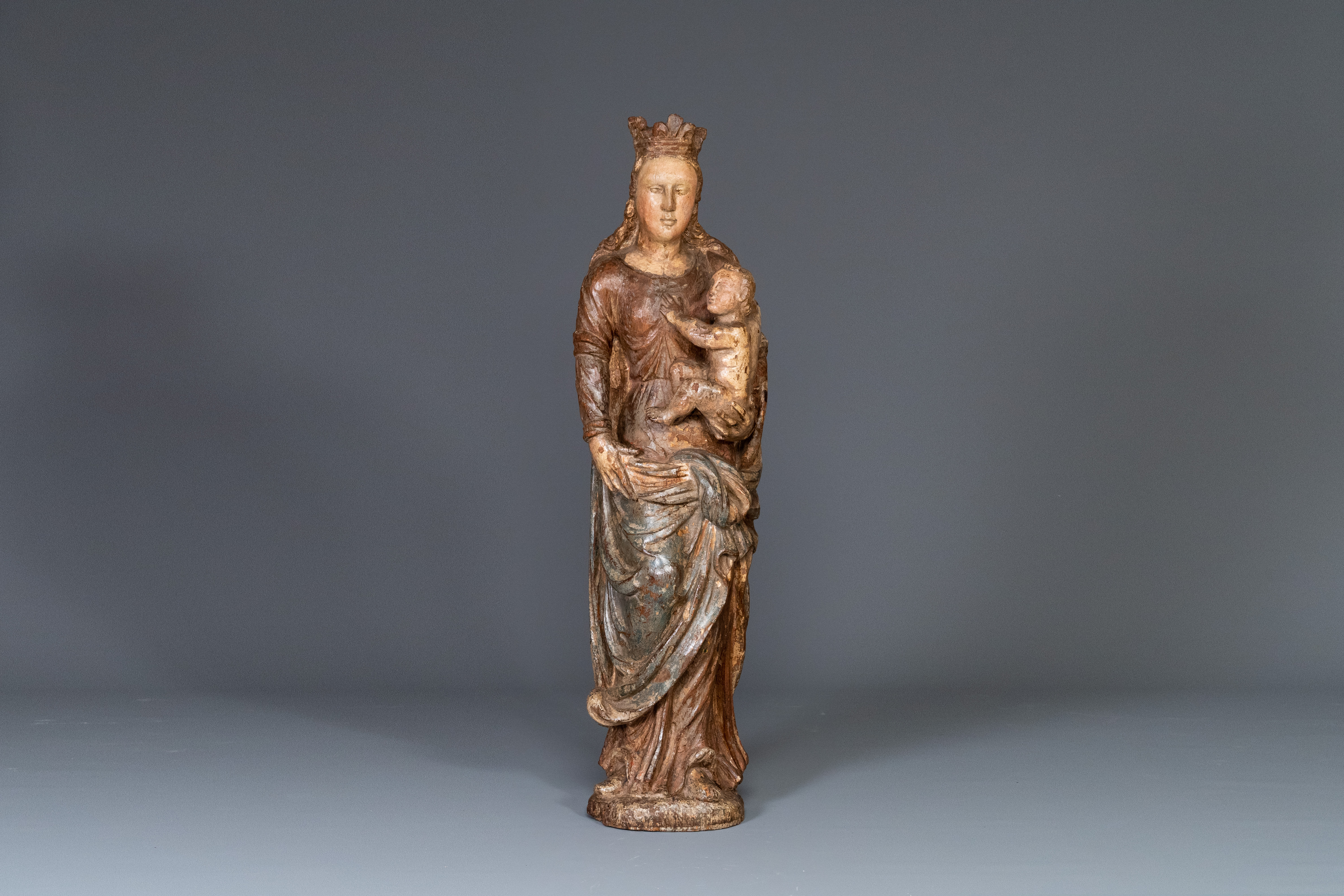 A polychromed carved oak figure of a Madonna and Child, France, 2nd half of 16th C.