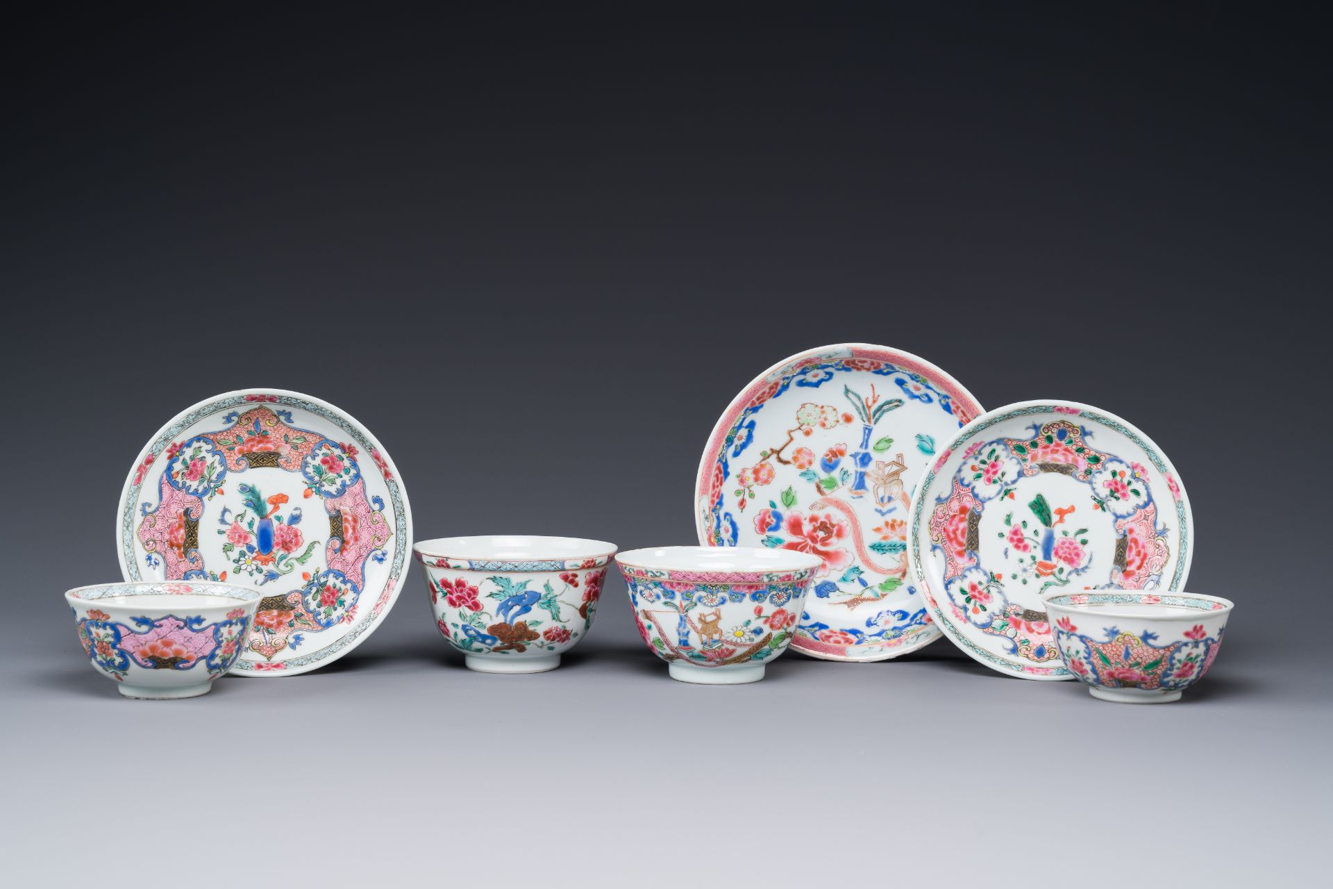 Four Chinese famille rose cups and three saucers with floral design, Yongzheng