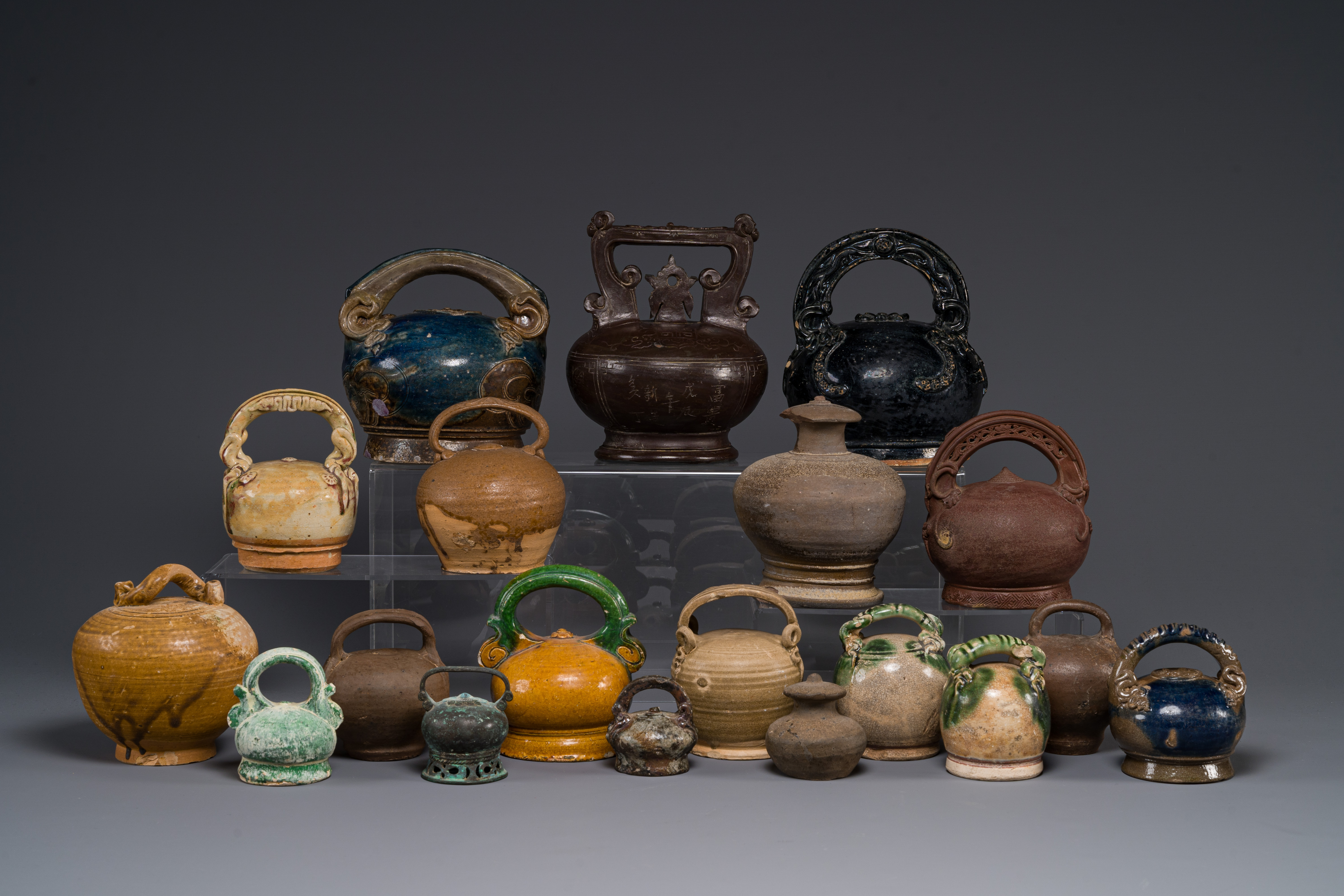 A large collection of nineteen Vietnamese stoneware lime pots, 14th C. and later - Image 2 of 2