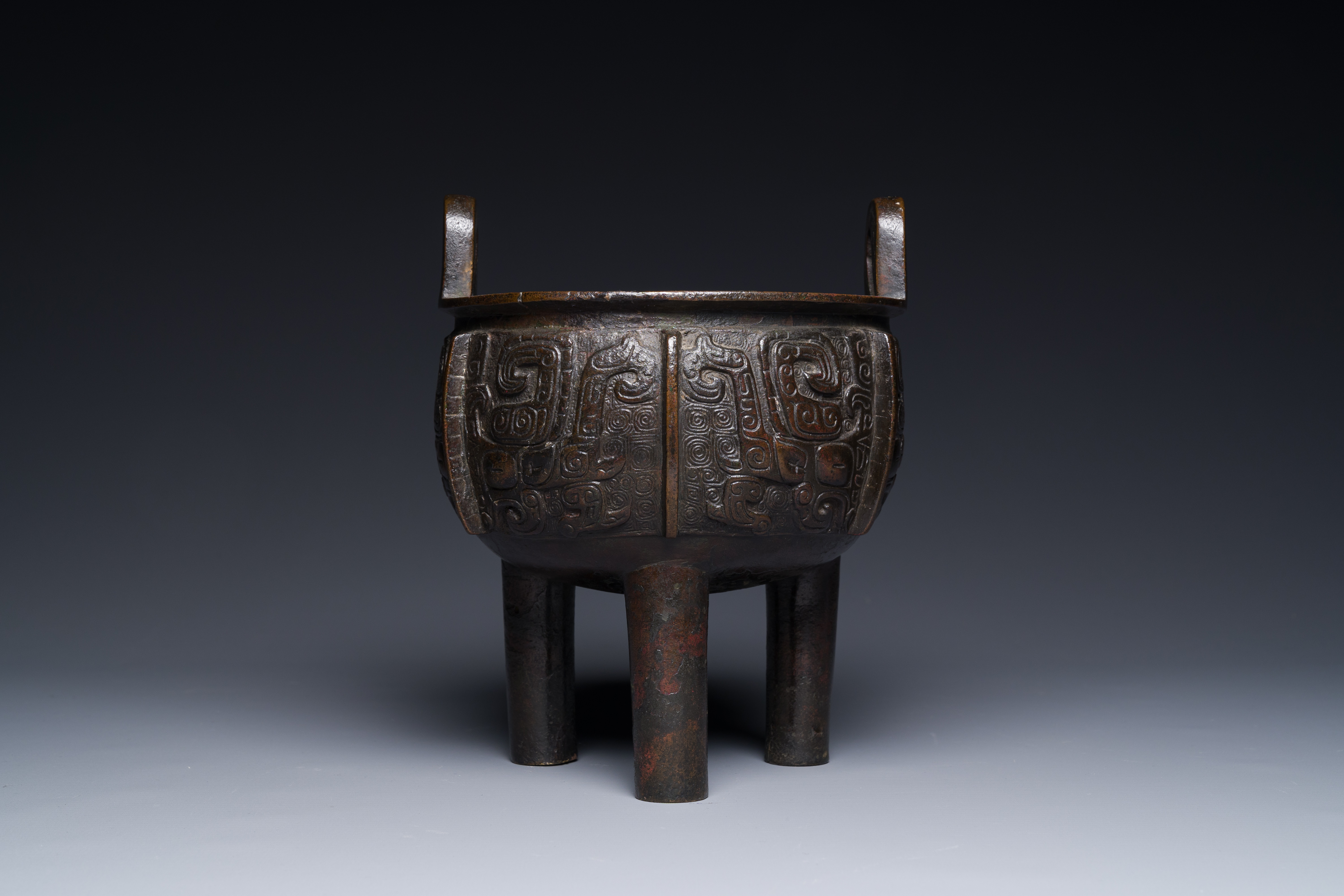 A Chinese archaistic bronze tripod censer on wooden stand, 'ding', Song/Ming - Image 6 of 21