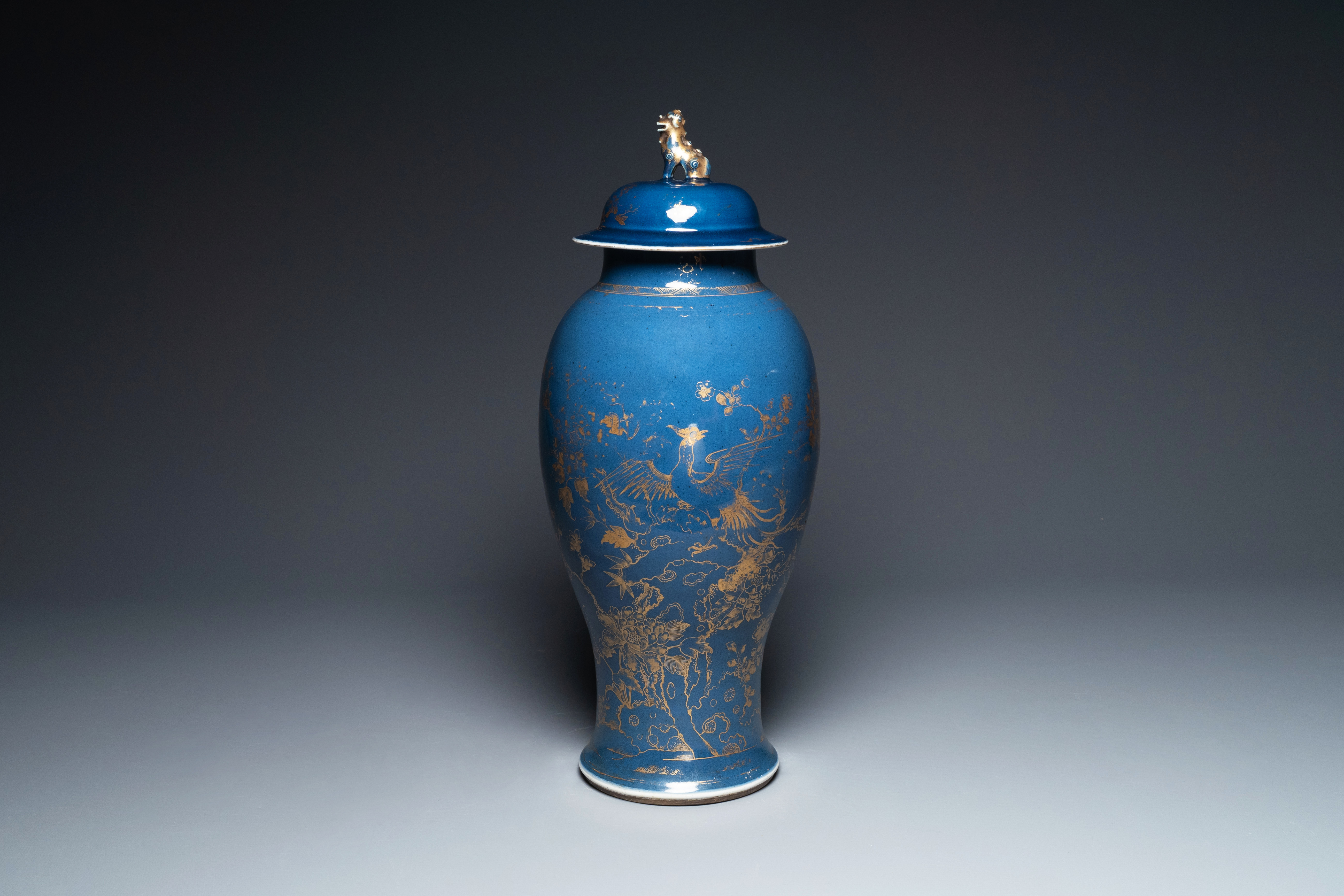 A Chinese gilt-decorated powder-blue vase with a phoenix among blossoming branches , Qianlong