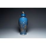 A Chinese gilt-decorated powder-blue vase with a phoenix among blossoming branches , Qianlong