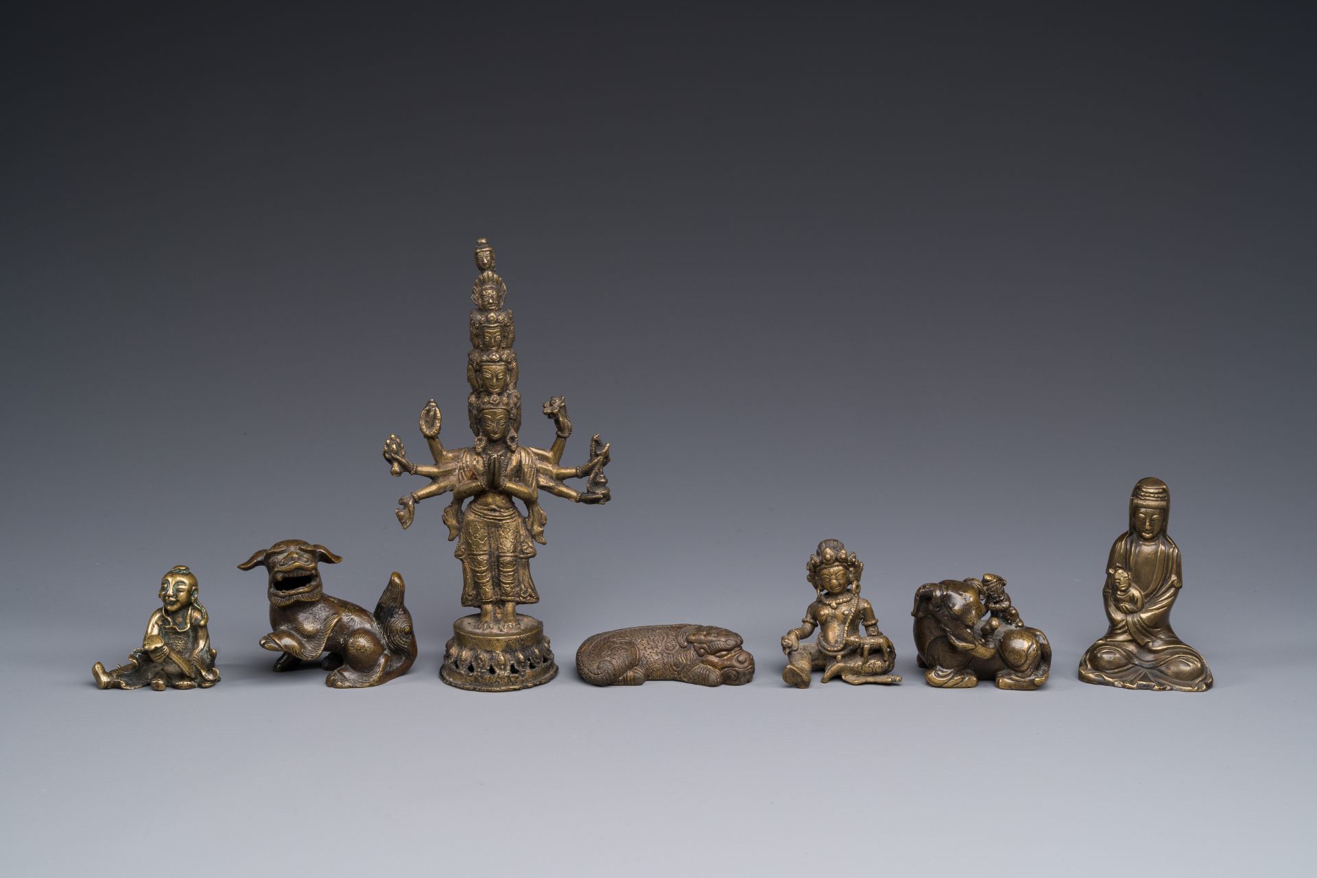 A collection of Chinese and Sino-tibetan bronze sculptures and paper weights, Qing - Image 2 of 4