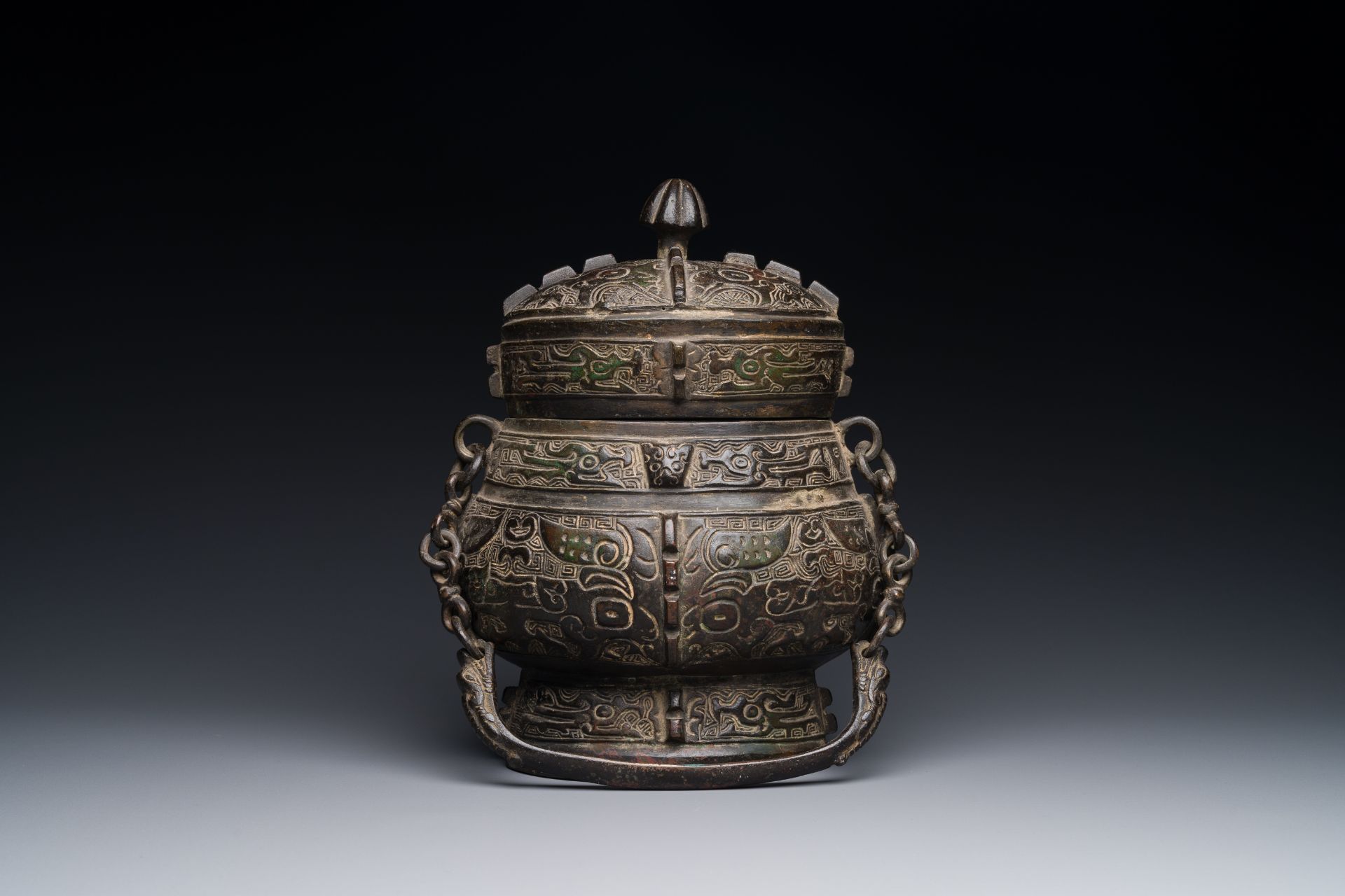 A Chinese bronze ritual wine vessel and cover, 'you', Yuan/Ming