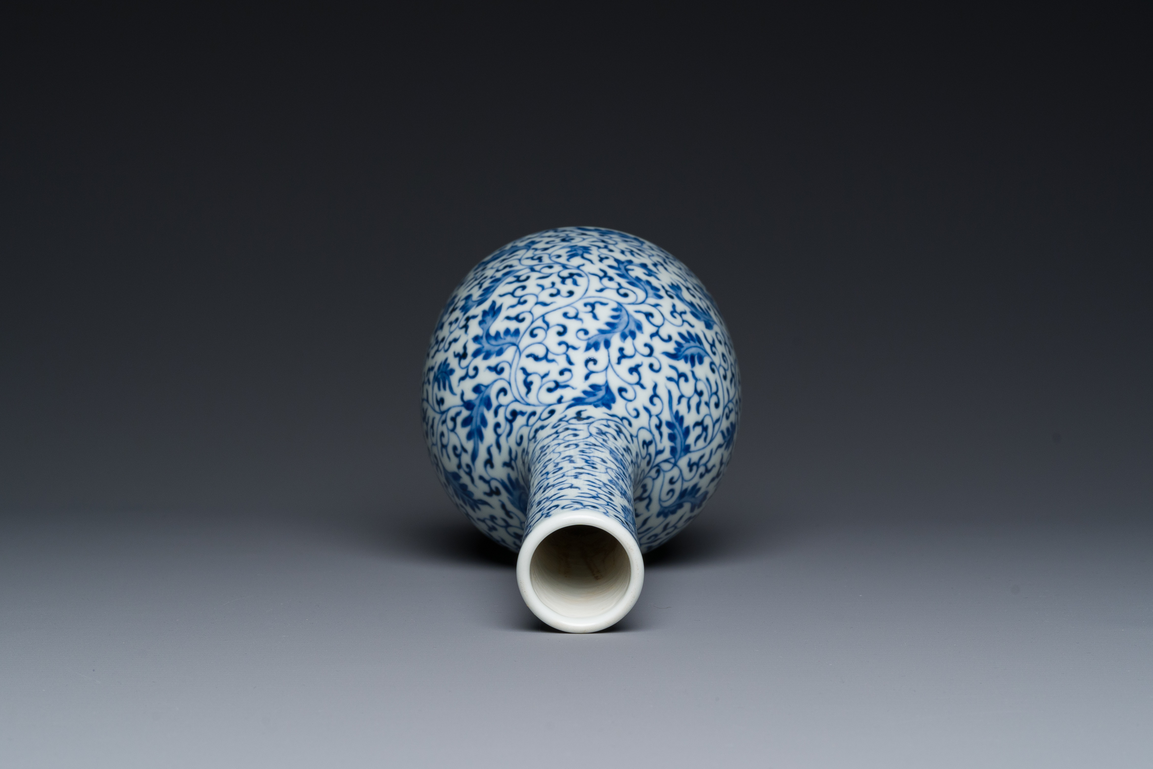 A Chinese blue and white 'lotus scroll' bottle vase, Yongzheng mark and possibly of the period - Image 5 of 6