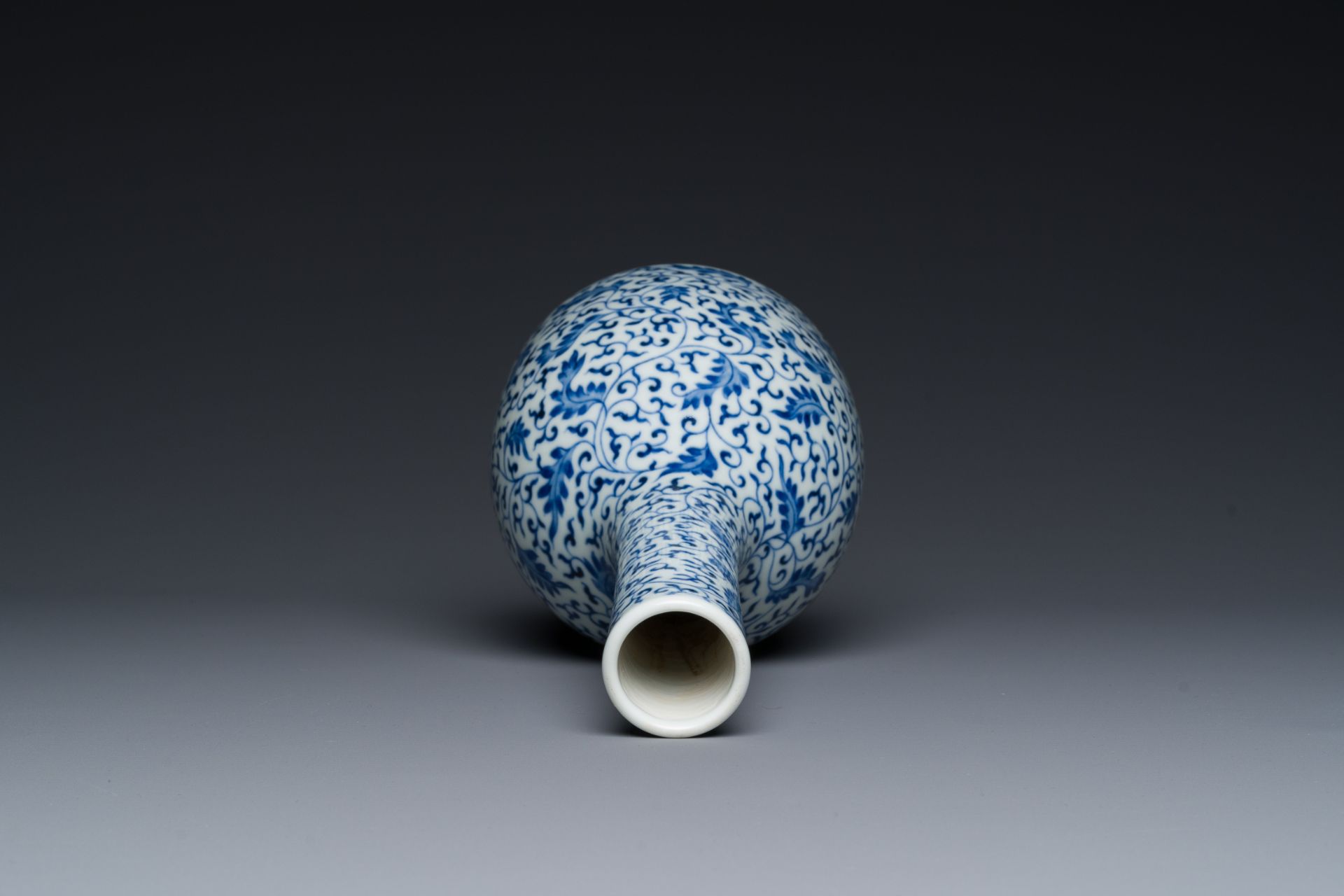 A Chinese blue and white 'lotus scroll' bottle vase, Yongzheng mark and possibly of the period - Image 5 of 6