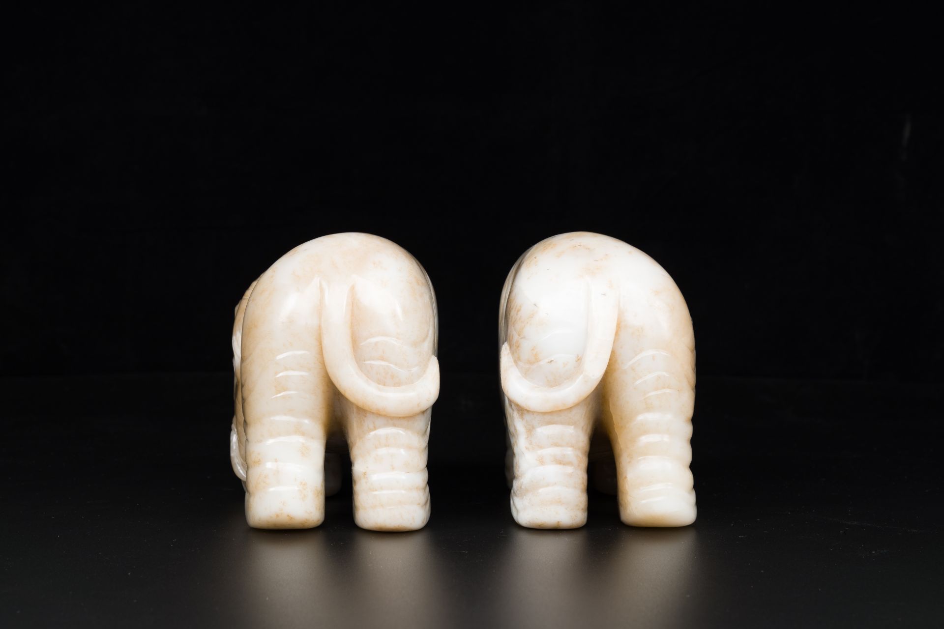 A pair of Chinese white and russet jade sculptures of elephants, Qianlong - Image 5 of 9