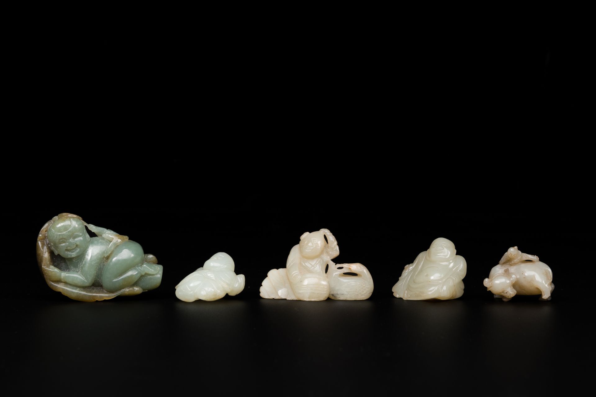 Five Chinese white and celadon jade sculptures of boys and Buddha, 18/19th C.