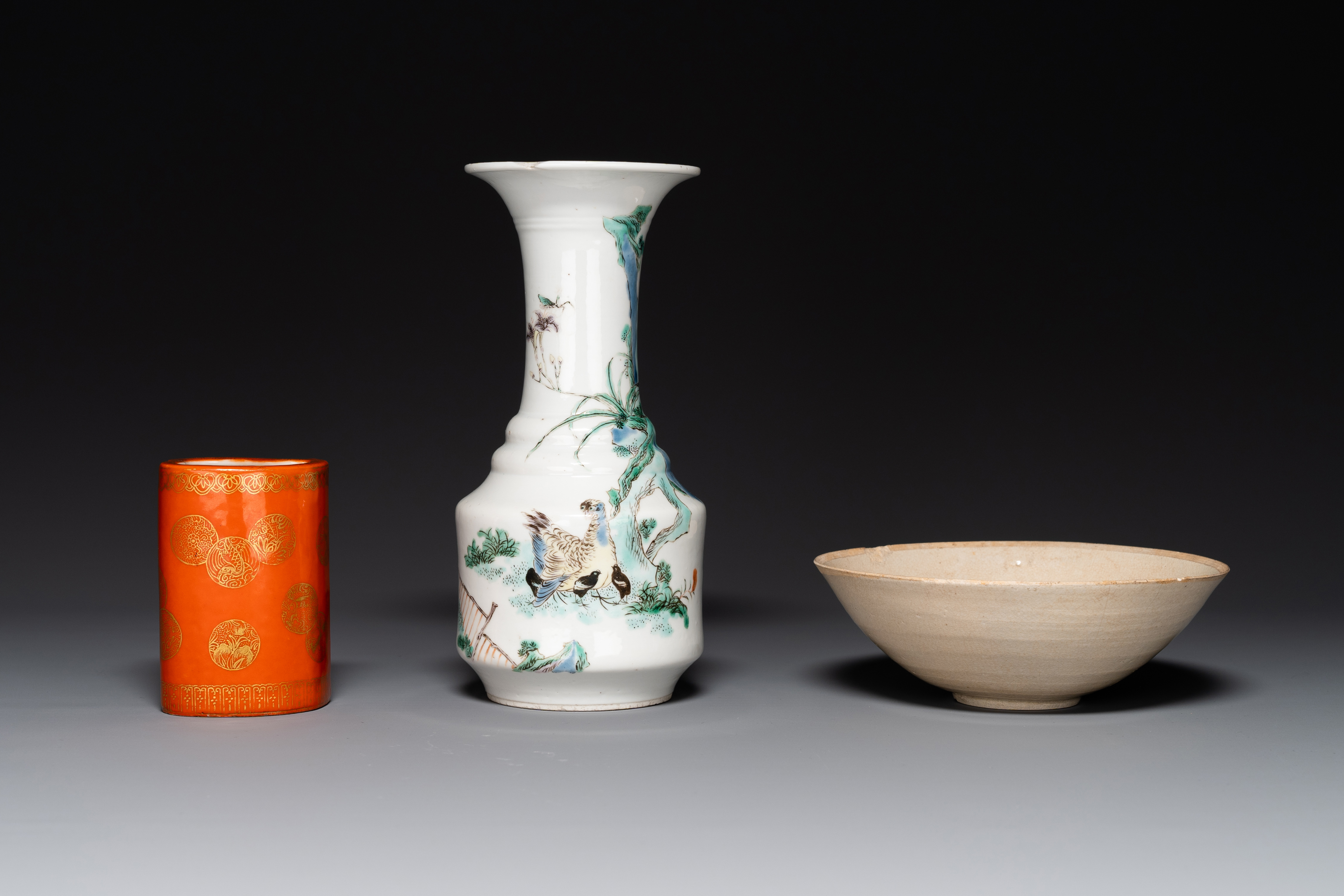 A Chinese gilt-decorated coral-red-glazed brush pot, a famille verte vase and a ding-type bowl, Guan