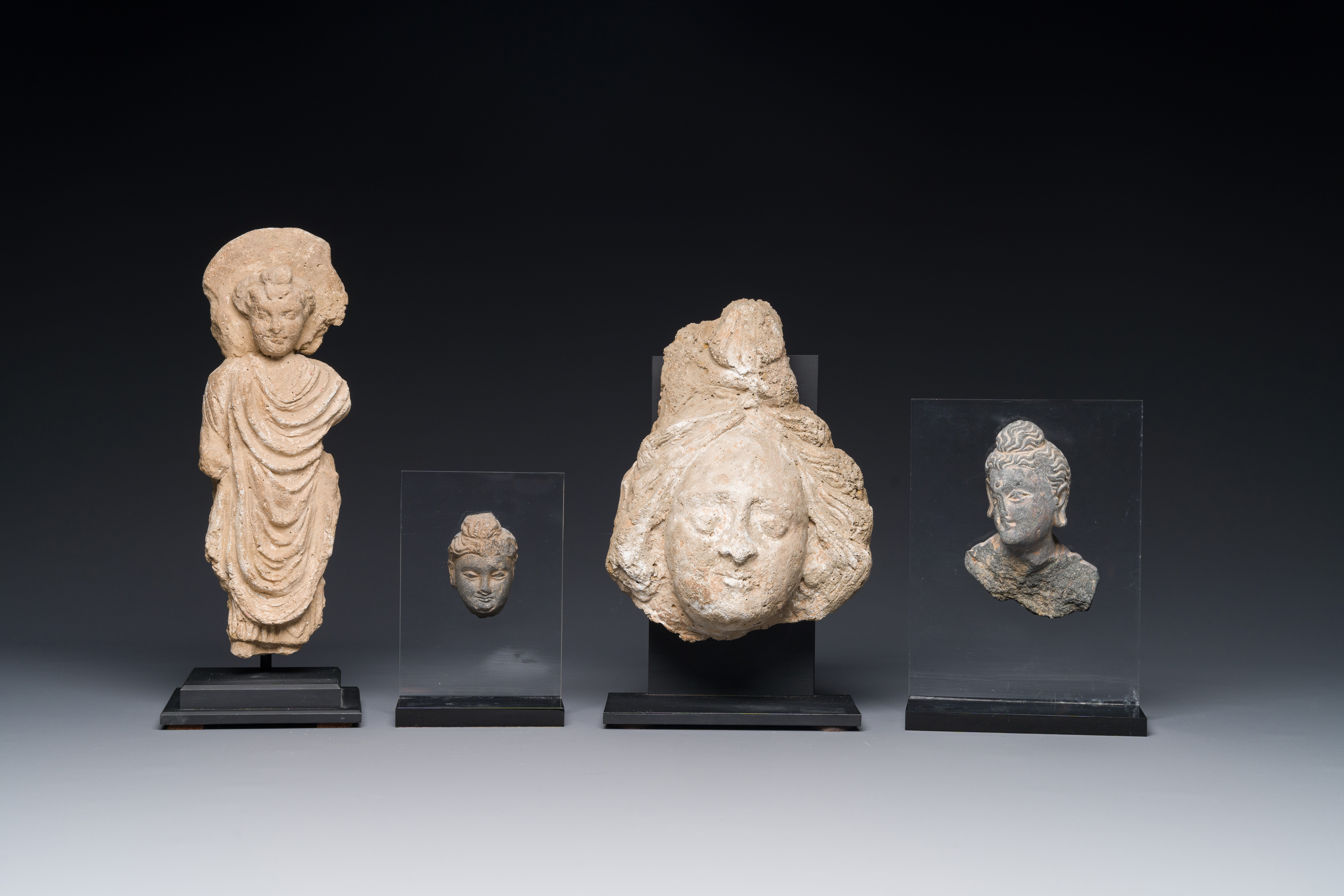 Two small Gandhara grey schist Bodhisattva heads, a stucco sculpture of Bodhisattva and a stucco fem - Image 6 of 15