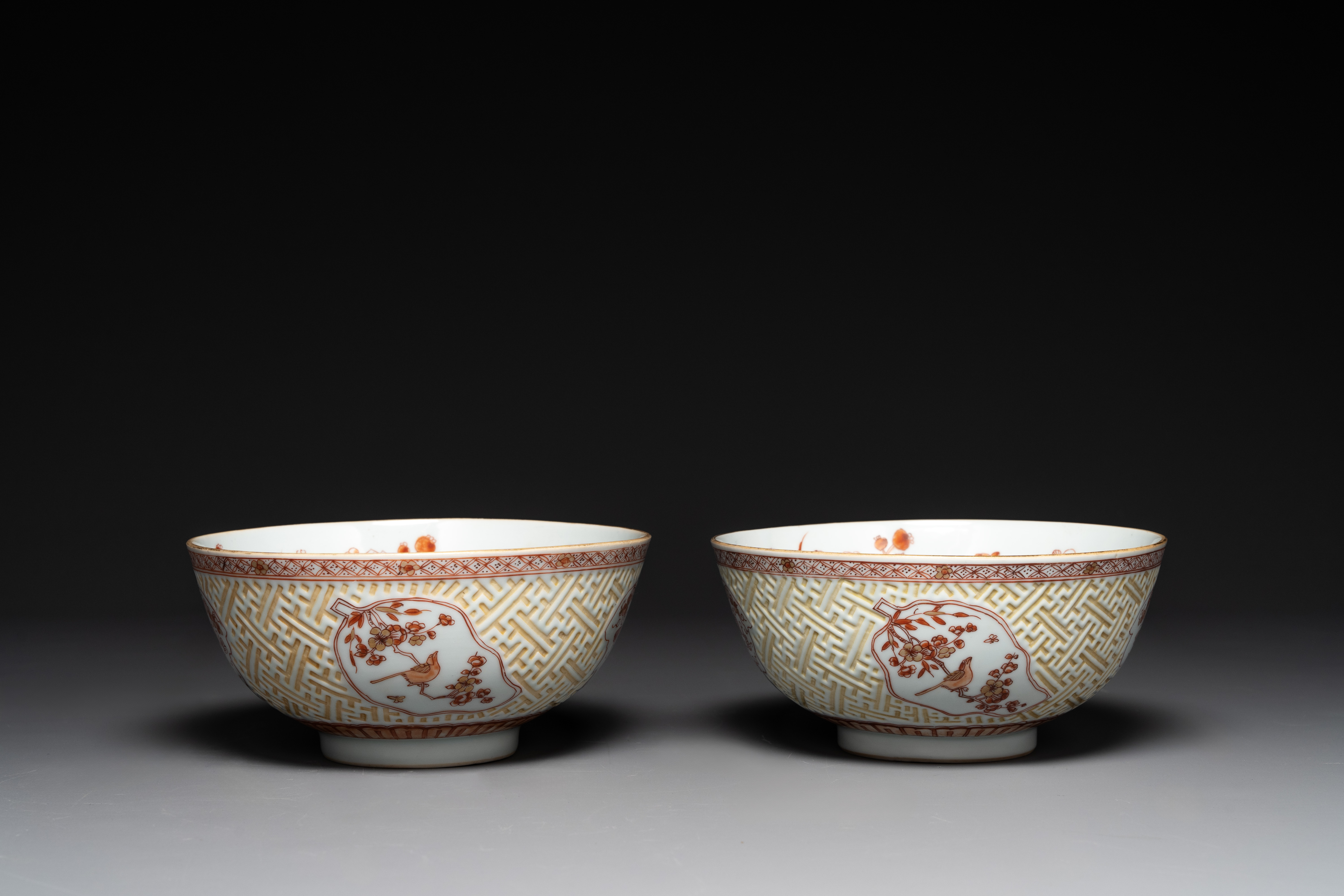 A pair of Chinese iron-red-decorated and gilt bowls with relief design, Kangxi - Image 4 of 8