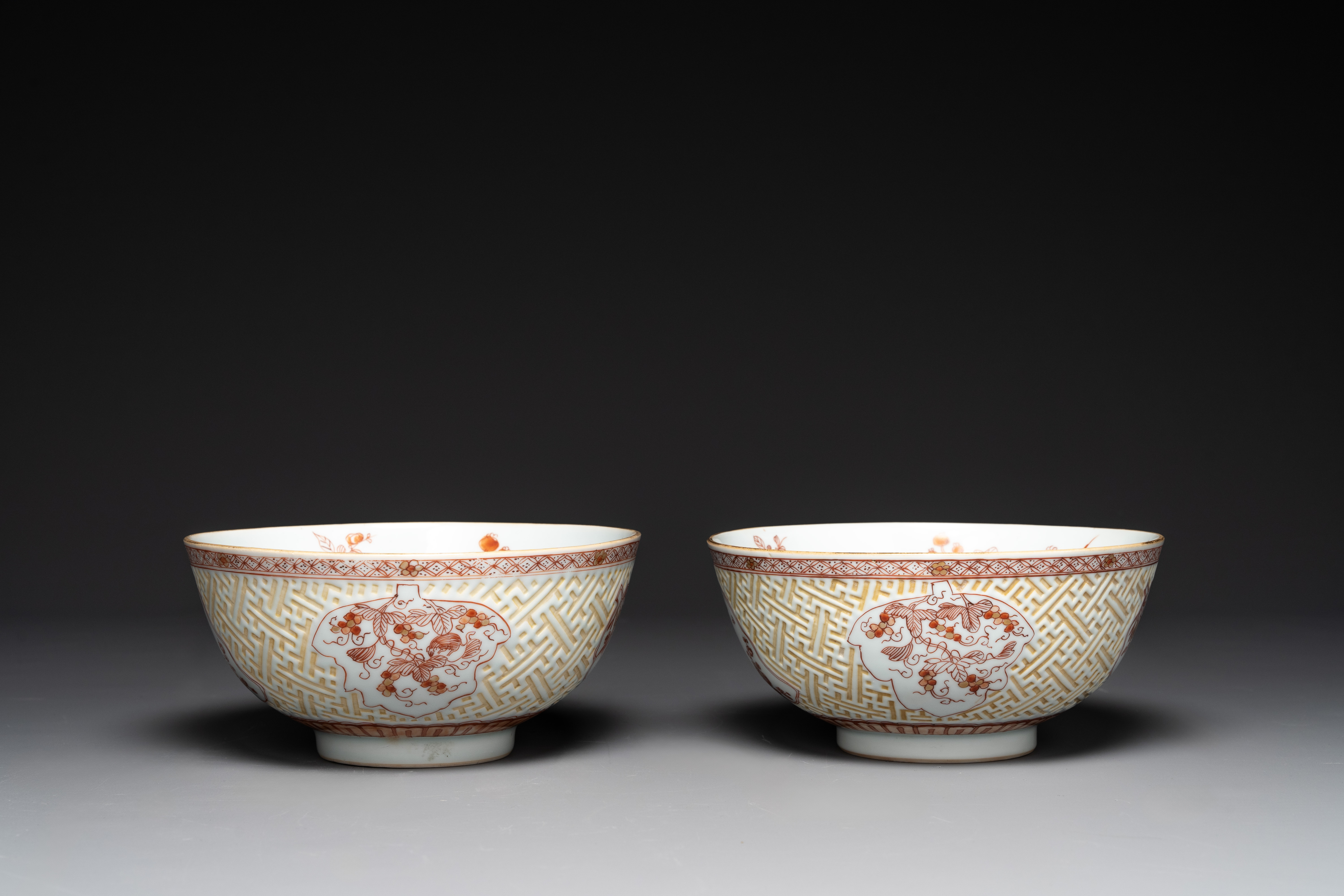 A pair of Chinese iron-red-decorated and gilt bowls with relief design, Kangxi - Image 3 of 8