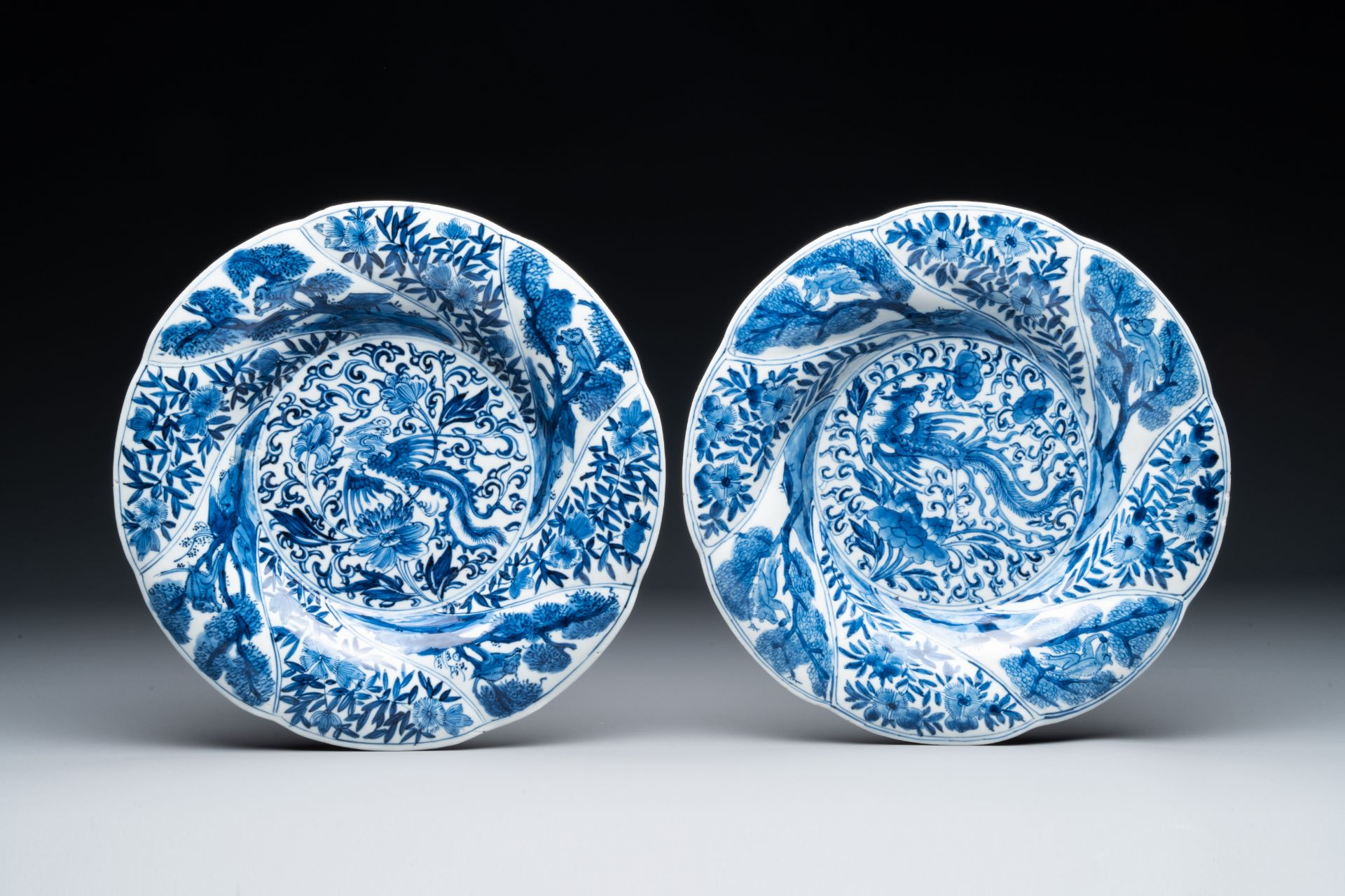 Four Chinese blue and white lobed 'phoenix and monkey' plates, flower mark, Kangxi - Image 2 of 5