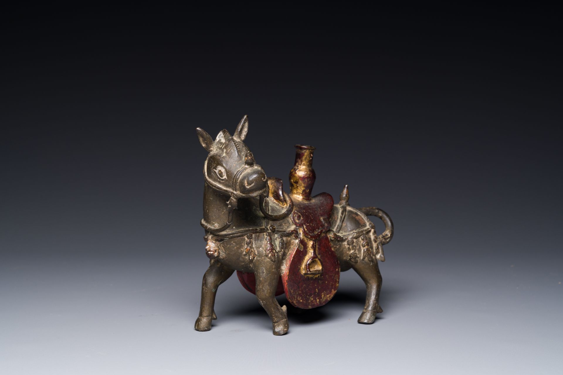 A rare Chinese partly lacquered and gilt bronze incense holder in the shape of a horse, Yuan/early M