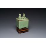 A Chinese Longquan celadon rectangular censer and cover on wooden stand, Ming