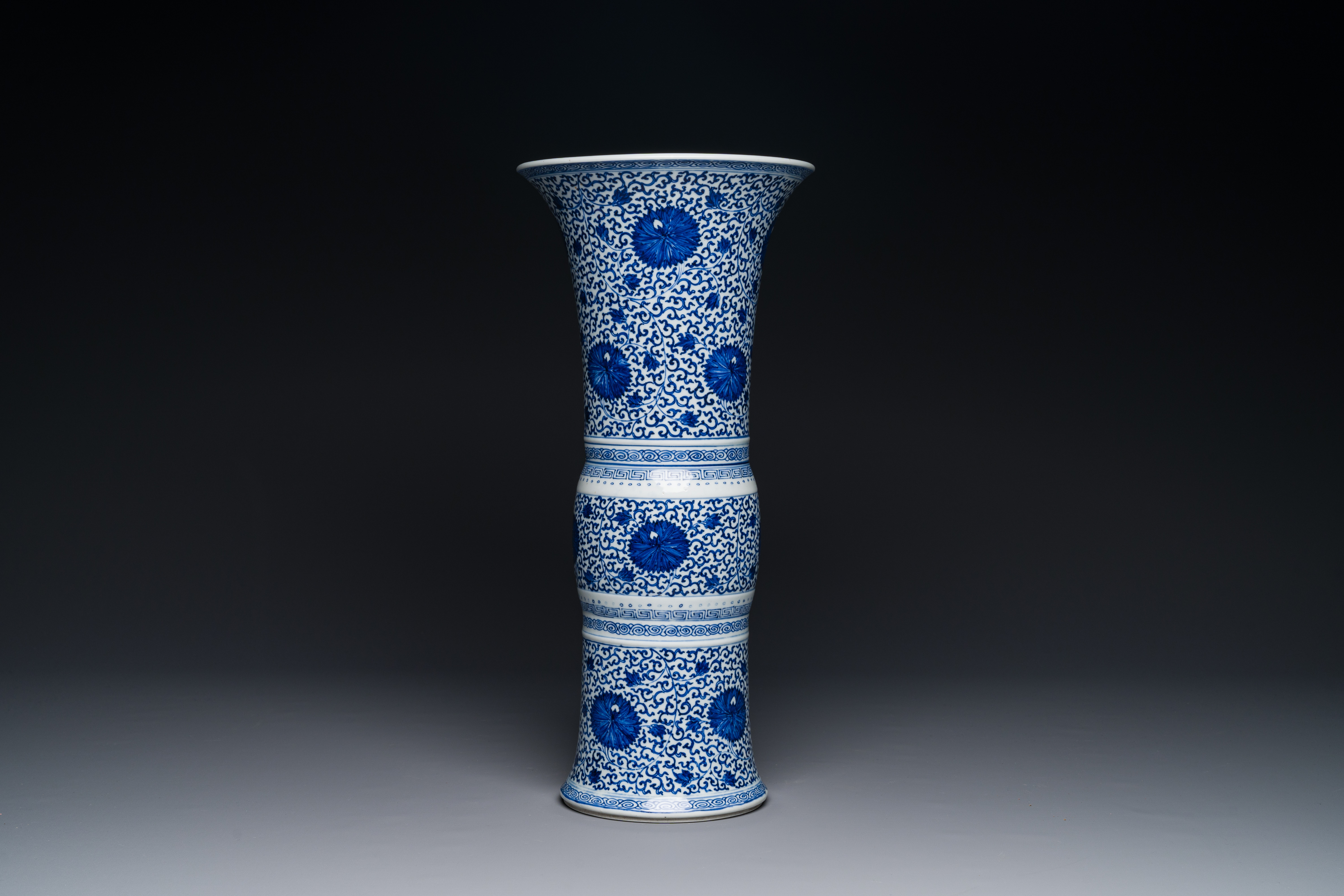 A Chinese blue and white 'chrysanthemum scroll' 'gu' vase, Kangxi