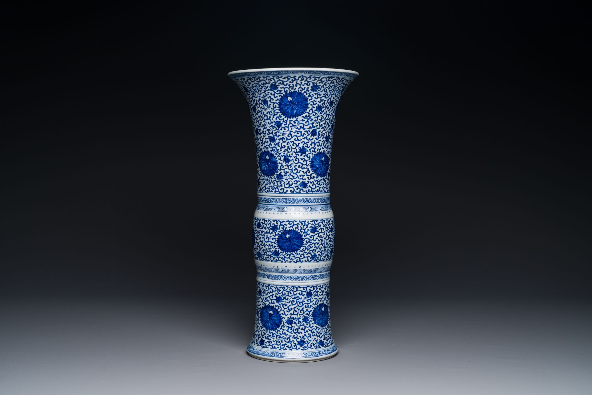 A Chinese blue and white 'chrysanthemum scroll' 'gu' vase, Kangxi