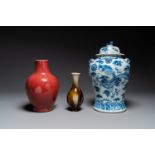 Two Chinese monochrome-glazed vases and a blue and white covered vase, 19th C.