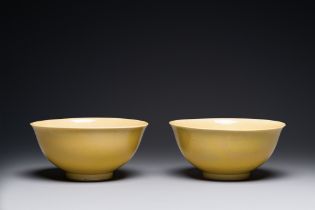 A pair of Chinese monochrome yellow-glazed bowls, Yongzheng mark, 19th C