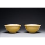 A pair of Chinese monochrome yellow-glazed bowls, Yongzheng mark, 19th C