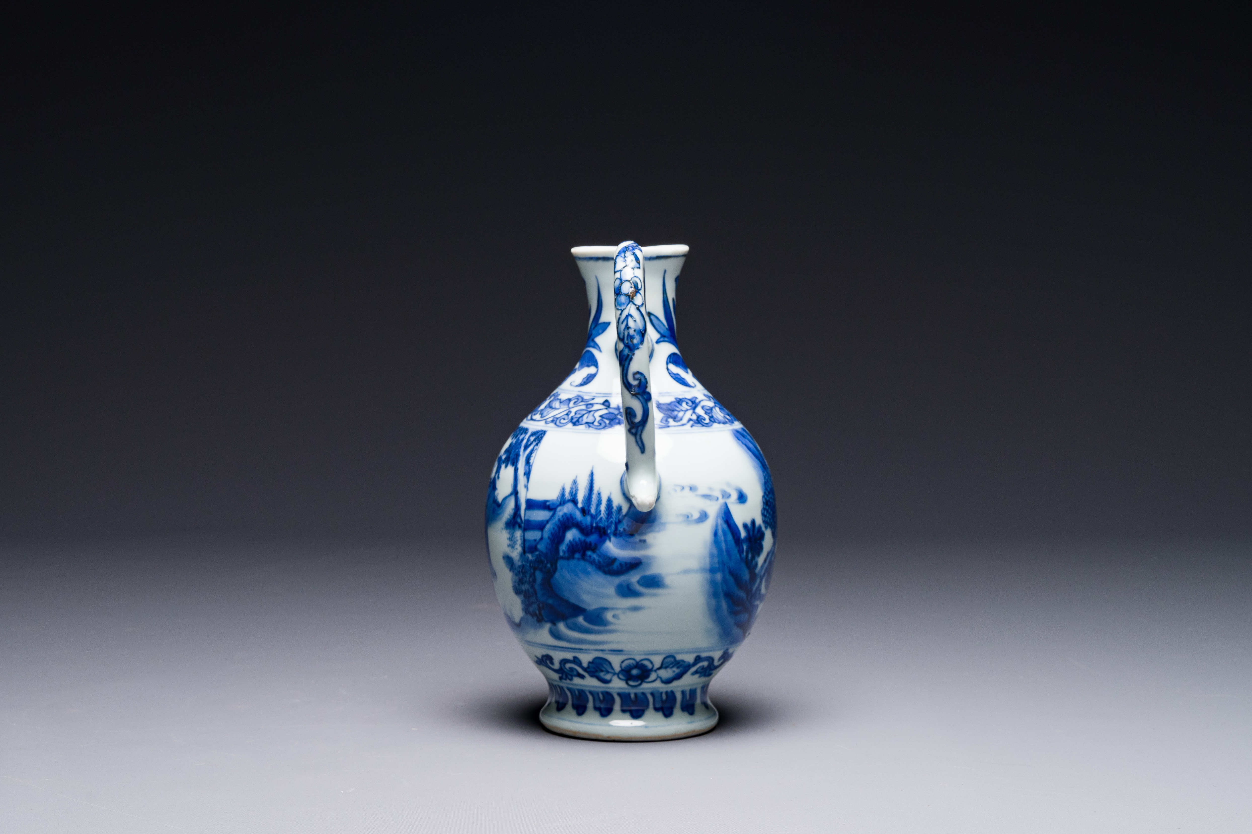 A Chinese blue and white ewer with figures in a landscape, Transitional period - Image 2 of 6