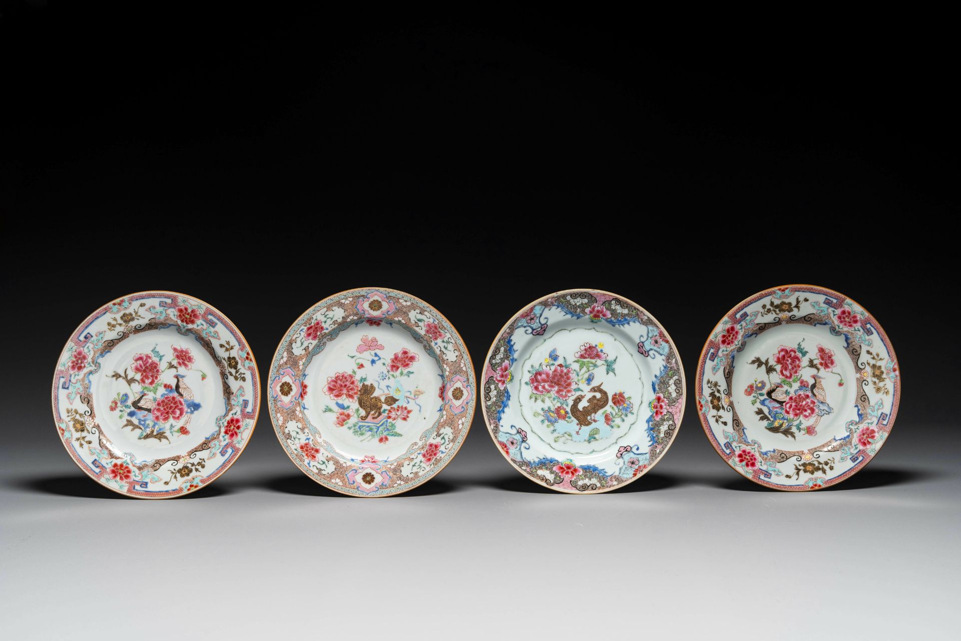 Four Chinese famille rose plates with flowers and animals, Yongzheng/Qianlong