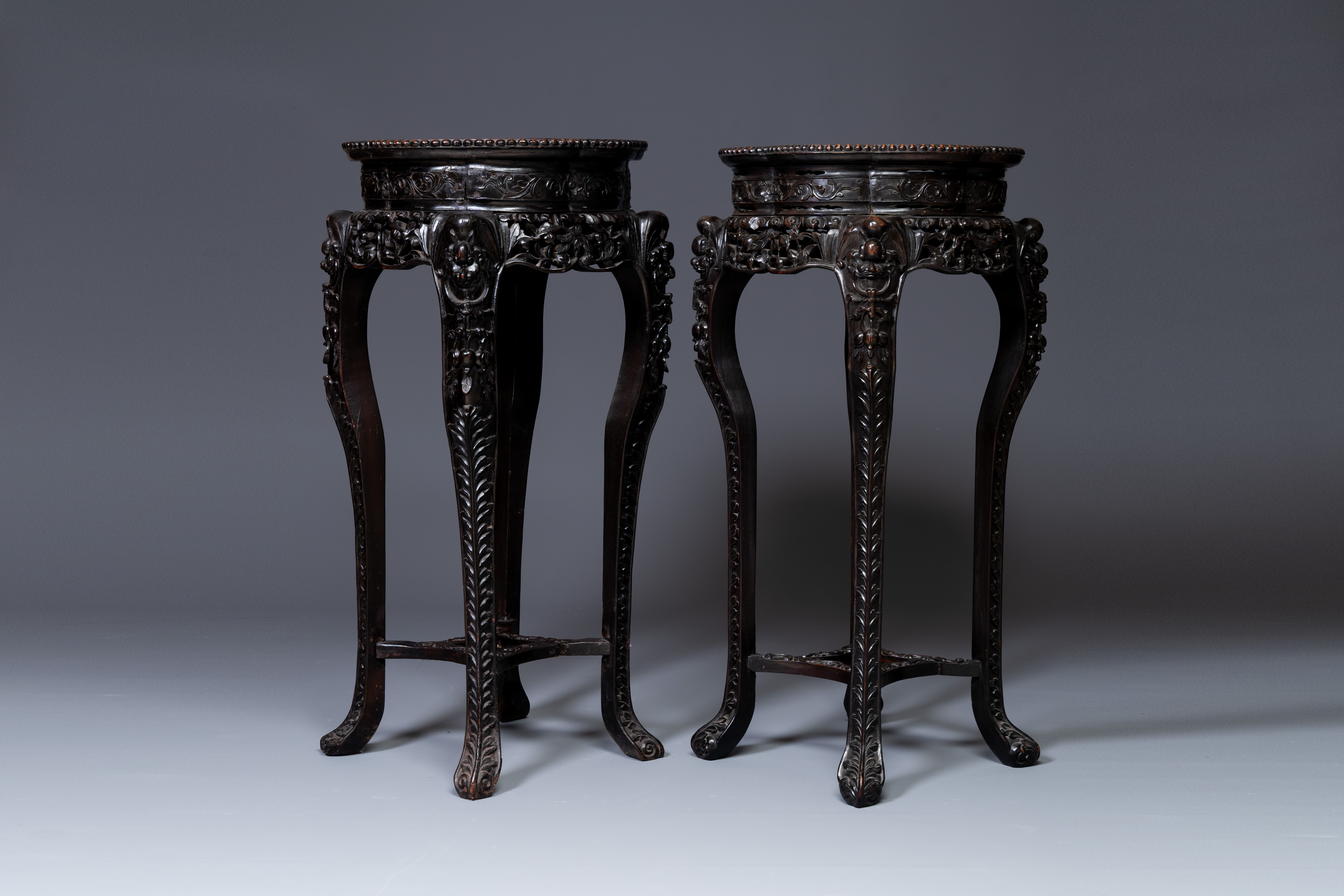 A pair of tall Chinese carved wooden stands with marble tops, 19th C. - Image 2 of 5