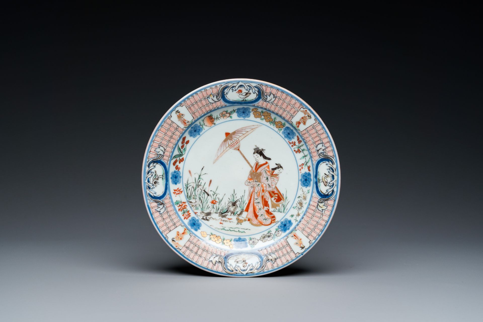 A Japanese Imari 'Parasol Ladies' plate after Cornelis Pronk, Edo, 18th C.