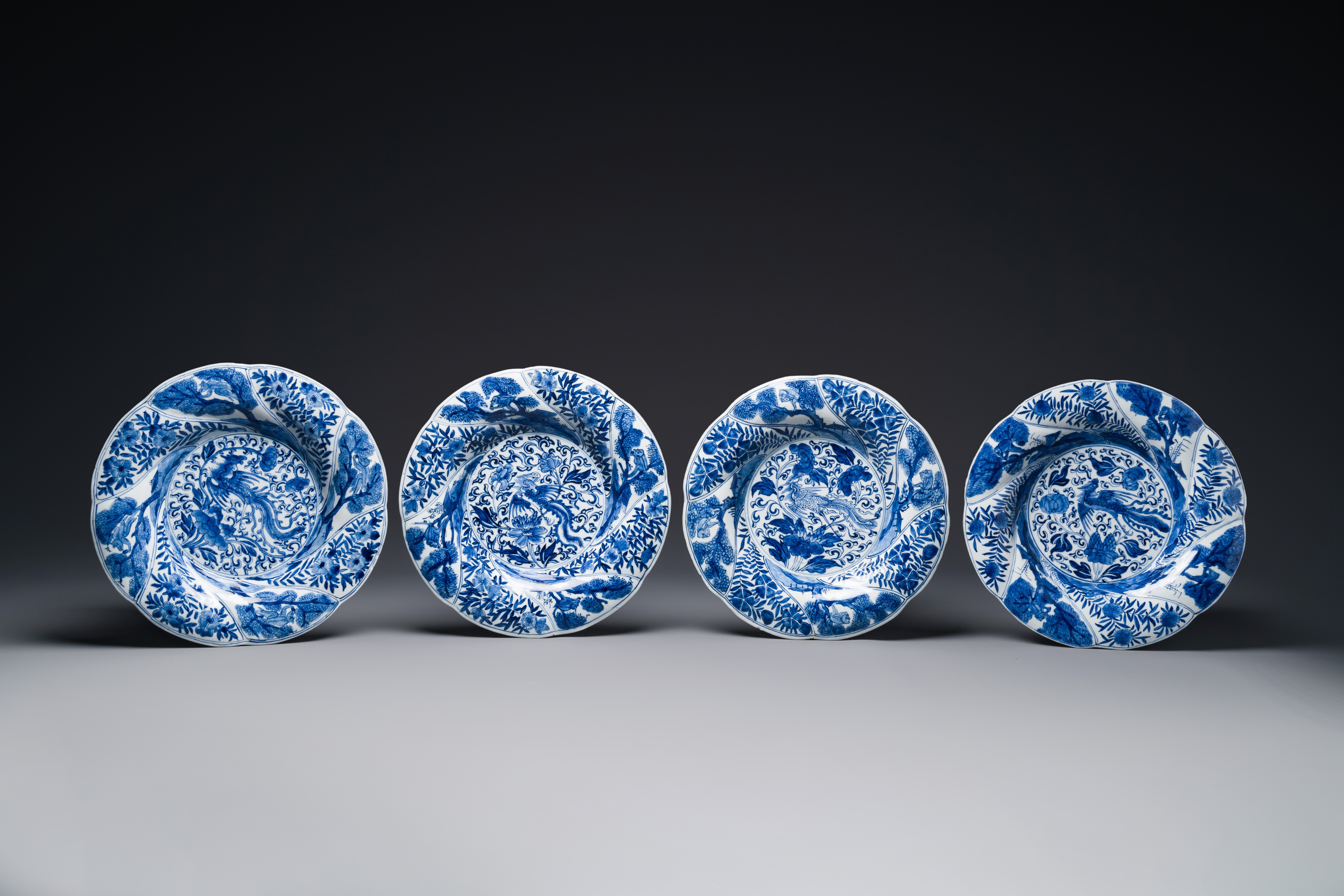 Four Chinese blue and white lobed 'phoenix and monkey' plates, flower mark, Kangxi - Image 4 of 5