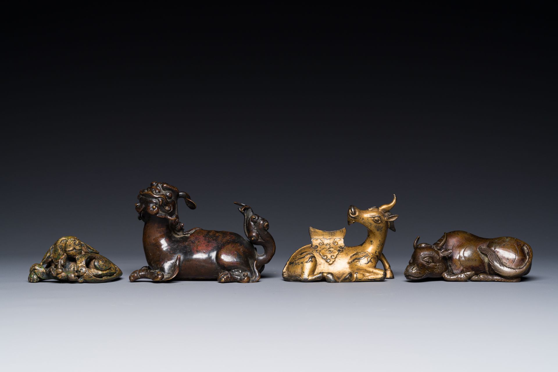 A group of four Chinese gilt bronze paper-weights, Ming/Qing - Image 2 of 7