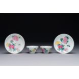 A pair of Chinese famille rose 'peony' cups and saucers, Yongzheng