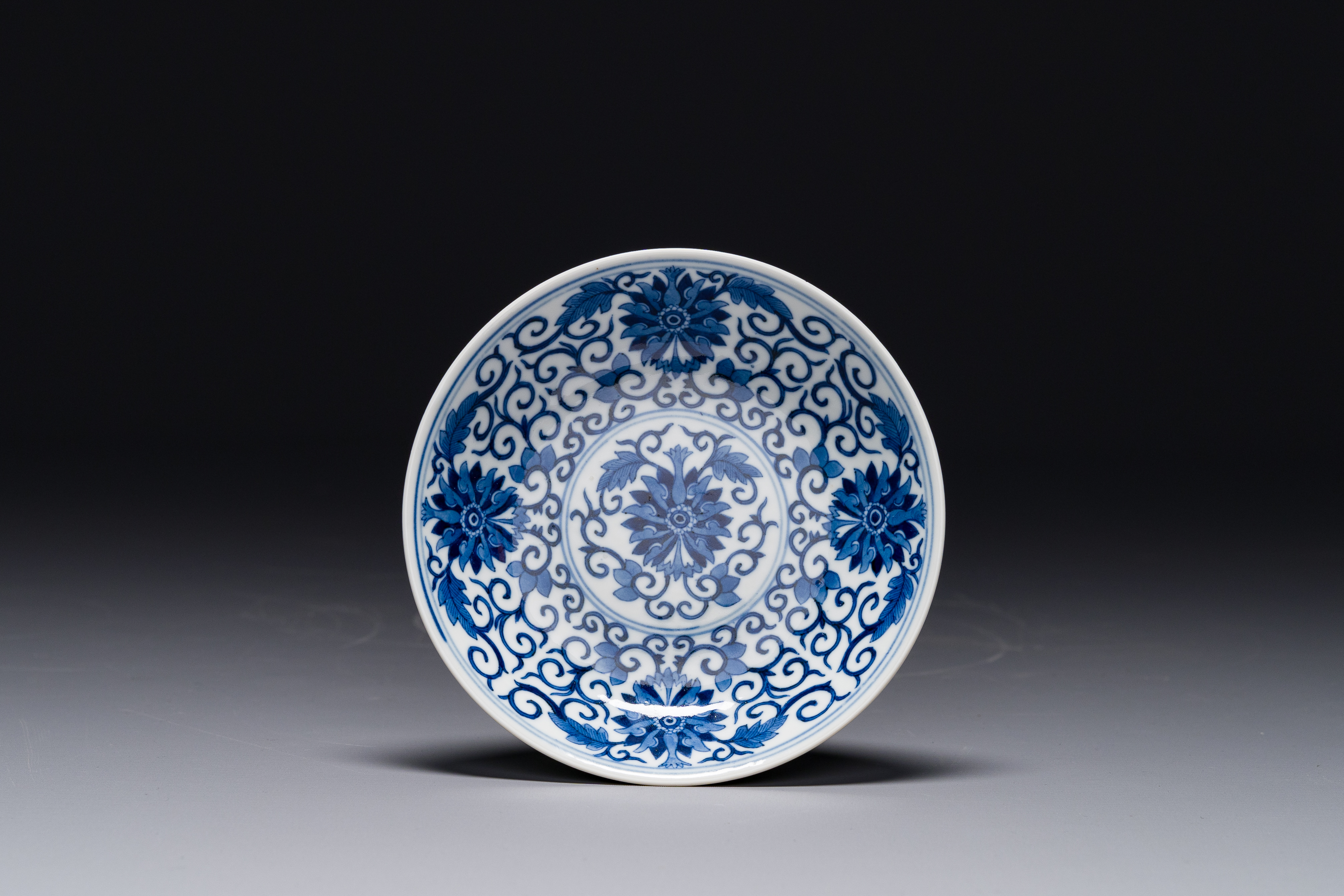 A Chinese blue and white 'lotus scroll' plate, Guangxu mark and of the period